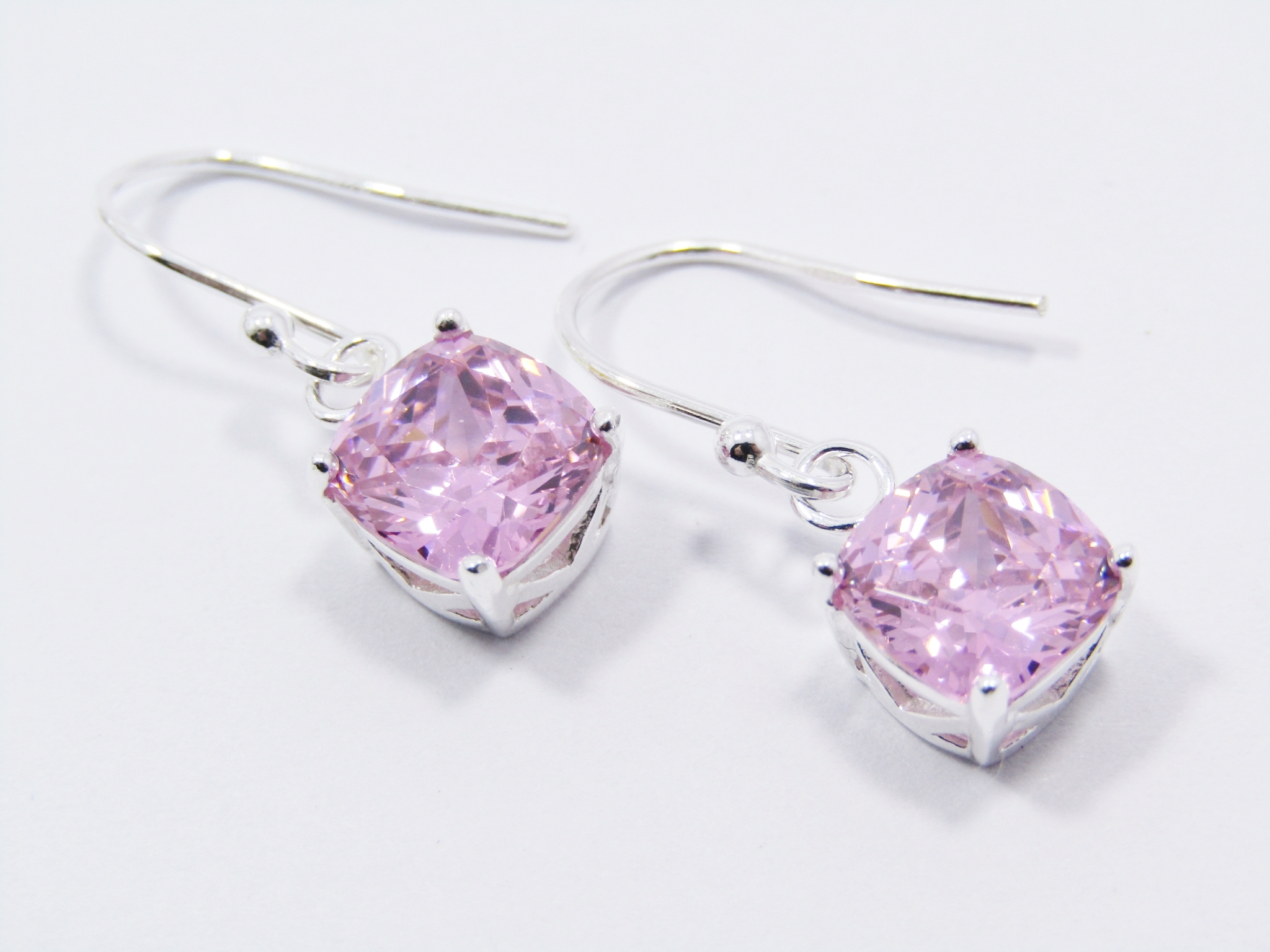 A Lovely Pair of Pink Zirconia Dangling Earrings in Sterling Silver.
