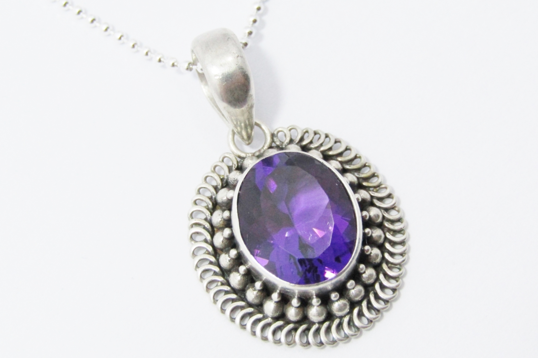 A Stunning Oval Amethyst Pendant On Chain in Sterling Silver.