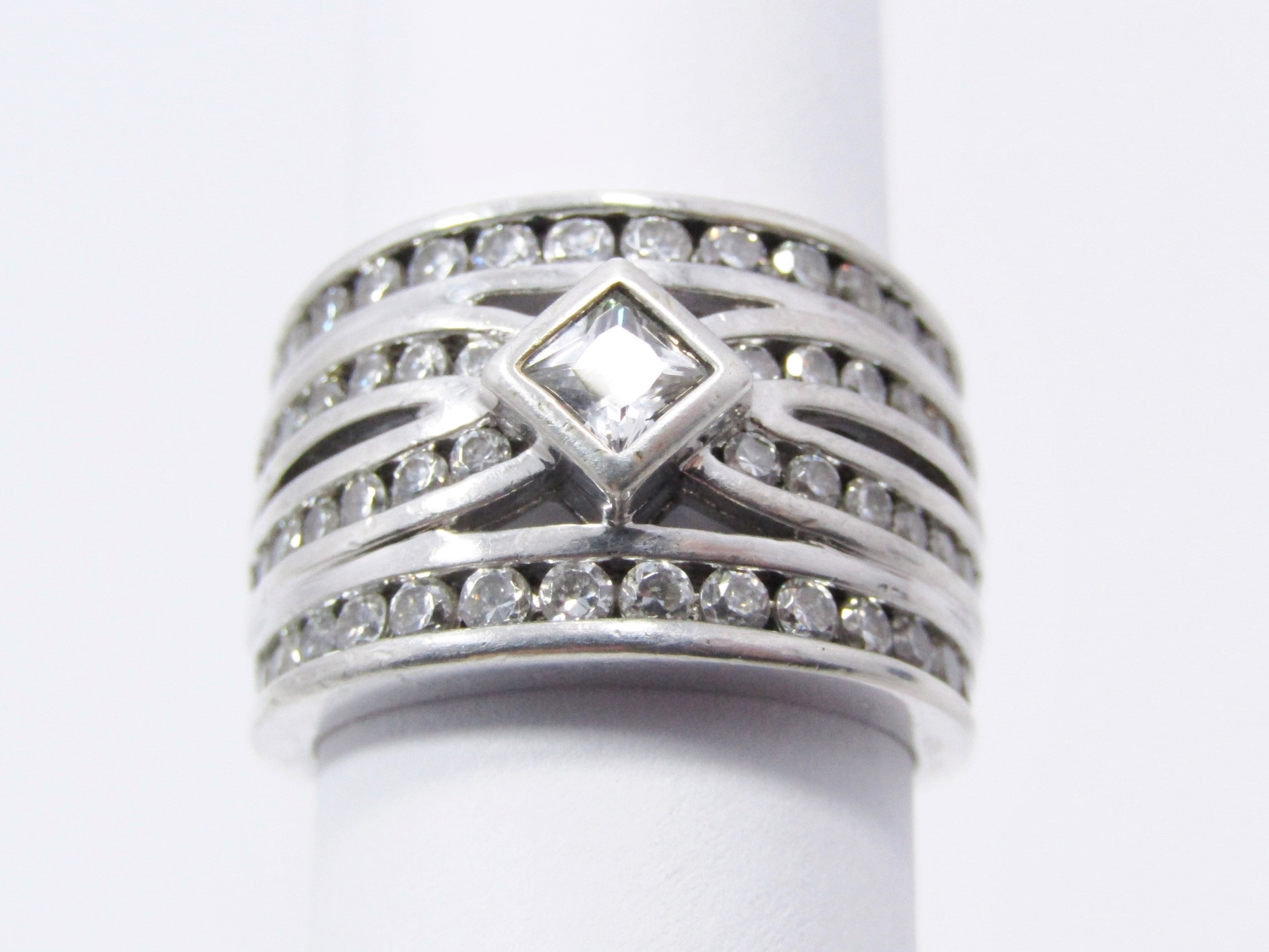 An Amazing Broad Four Band Into One Zirconia Ring in Sterling Silver.