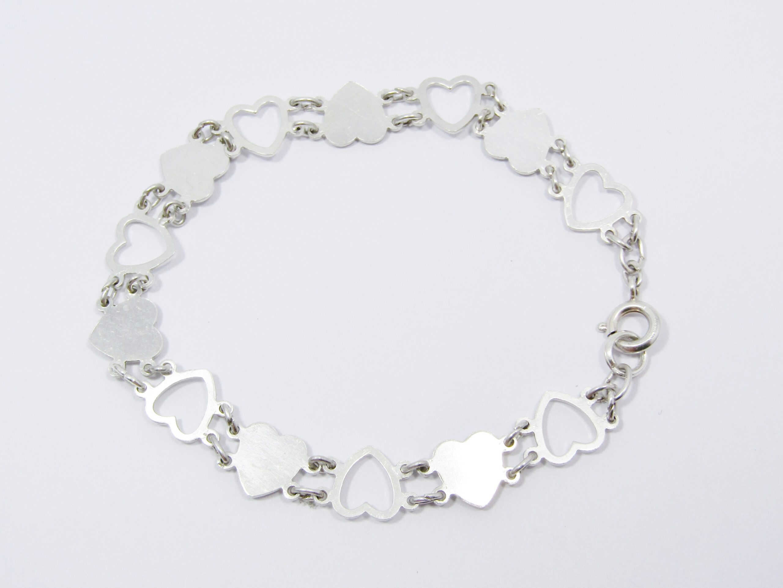 A Stunning Heart Cut Out Design Bracelet in Sterling Silver.