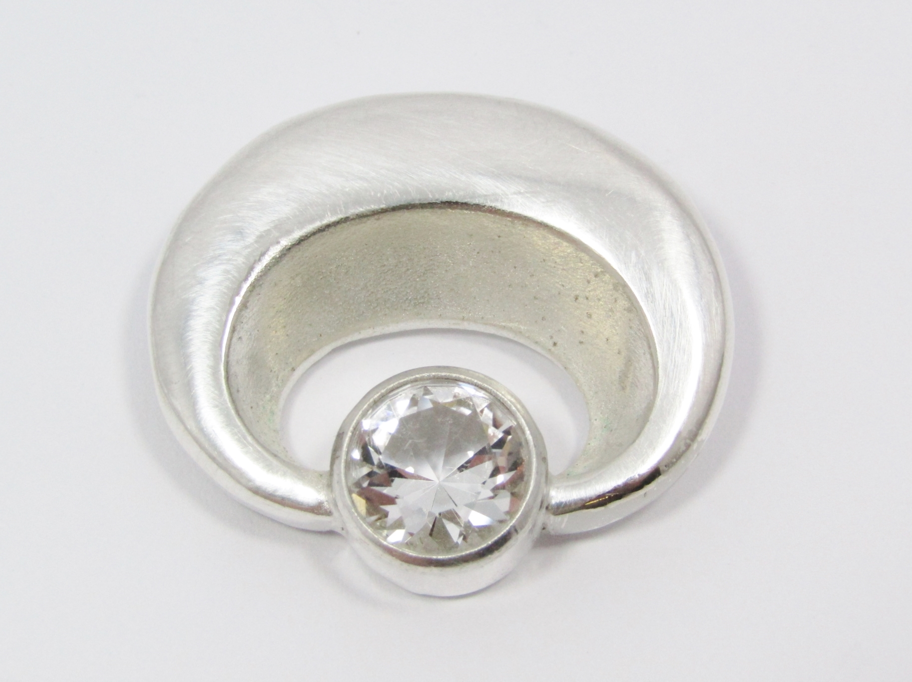 A Lovely Solid Modernist Style Brooch With a Rock Crystal in Silver.
