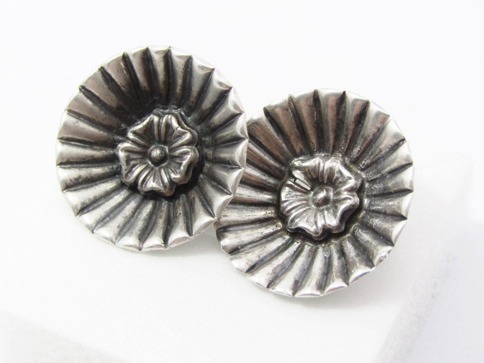 A Beautiful Candida Flower Design Clip On Earrings in Sterling Silver.