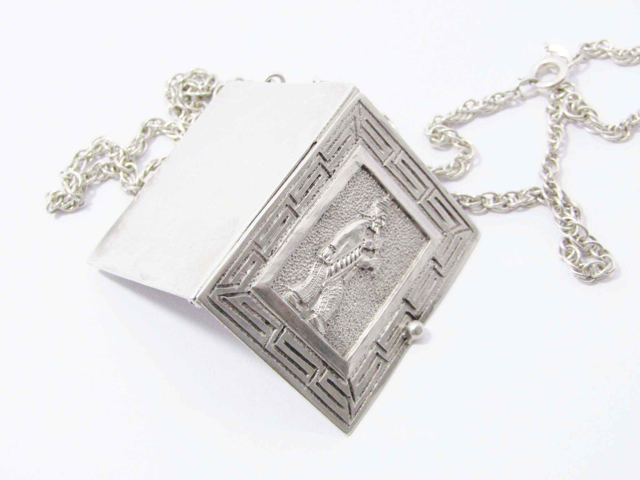 A Gorgeous Detailed Rectangular Book Design Locket On a long Chain in Sterling Silver.