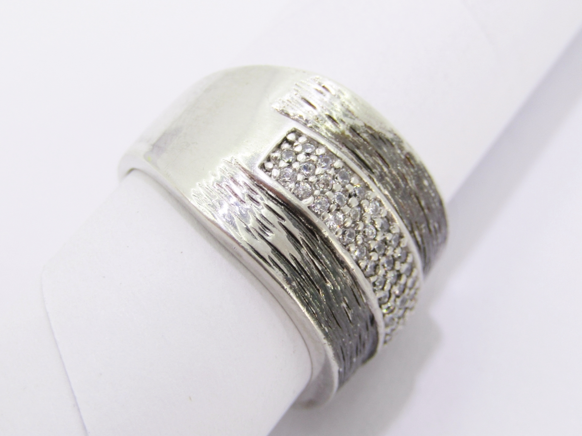 A Stunning Broad Textured Ring With Zirconia’s in Sterling Silver.