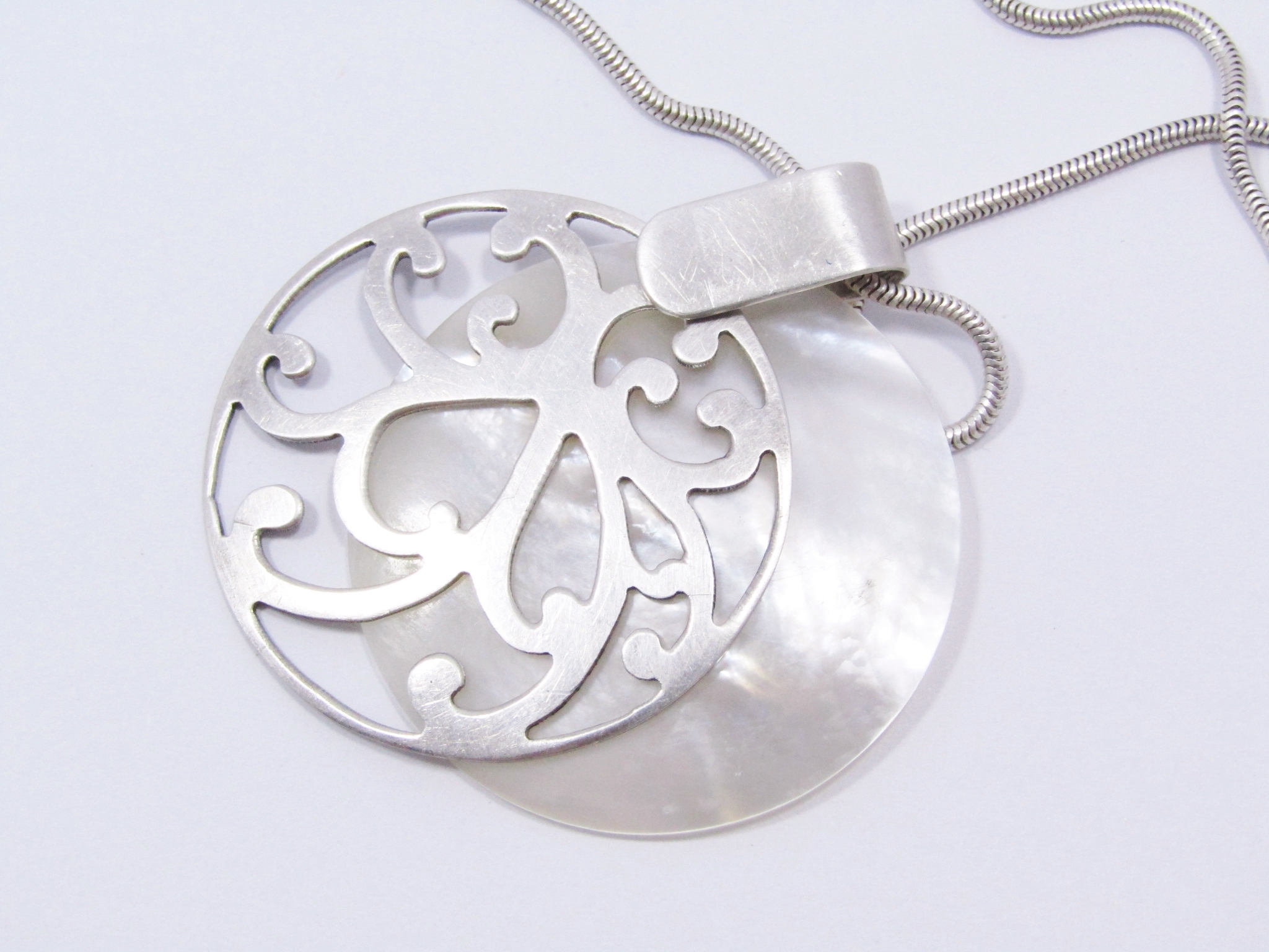 A Stunning Large Mother of Pearl Pendant On Chain in Sterling Silver.