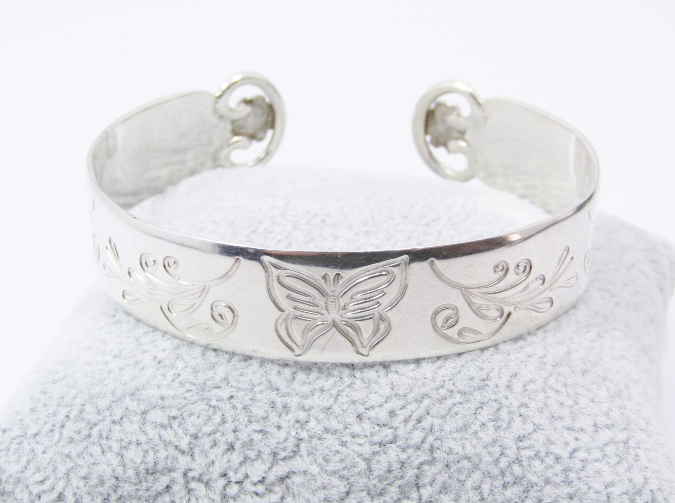 An Amazing Broad Engraved Cuff Bangle With a Flower Design Detail on The Ends of The Cuff in Sterling Silver.