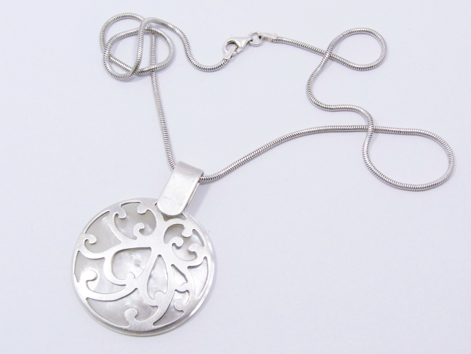 A Stunning Large Mother of Pearl Pendant On Chain in Sterling Silver.