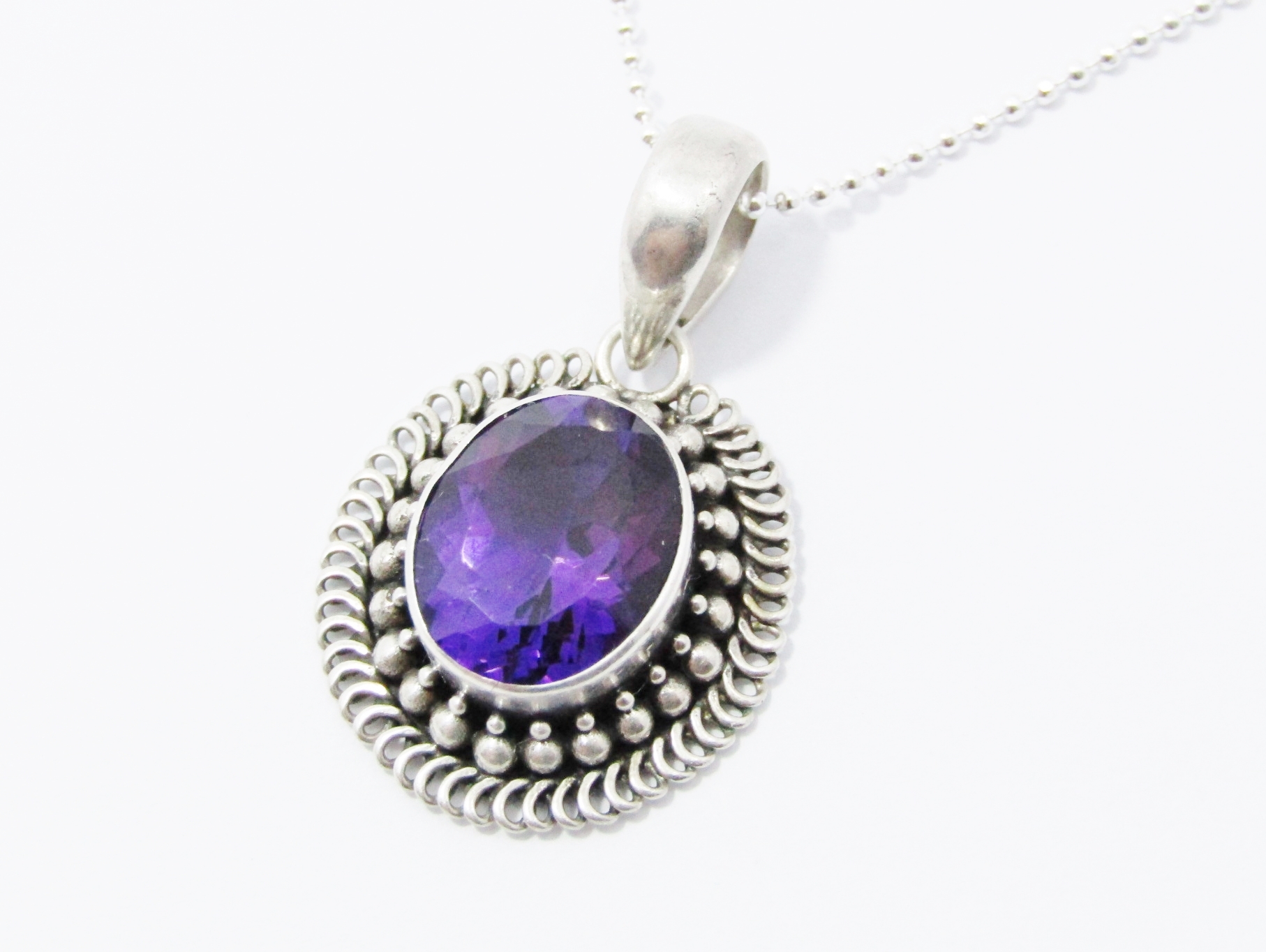A Stunning Oval Amethyst Pendant On Chain in Sterling Silver.