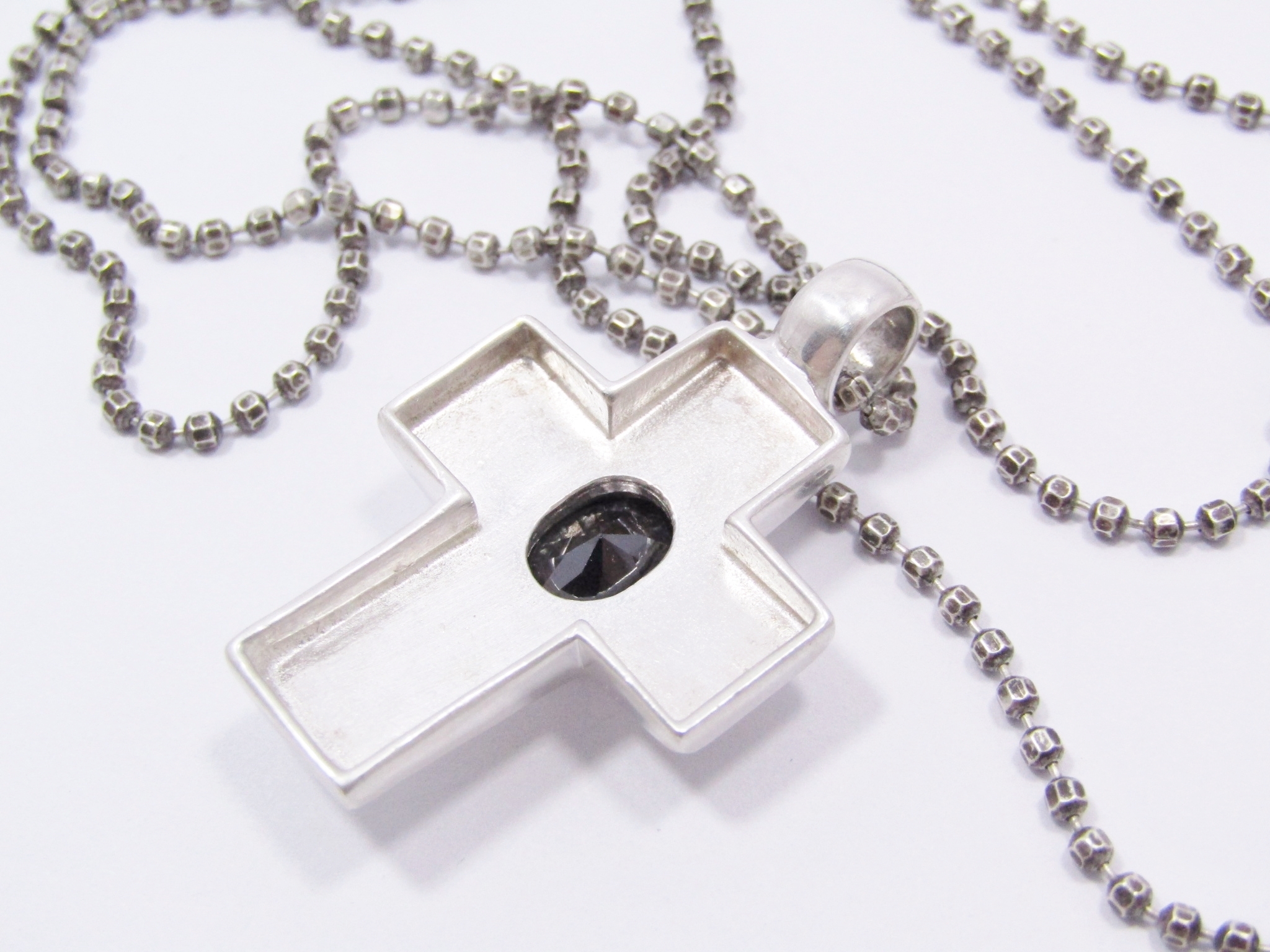 A Lovely Black Zirconia Cross Pendant On Chain in Sterling Silver.
