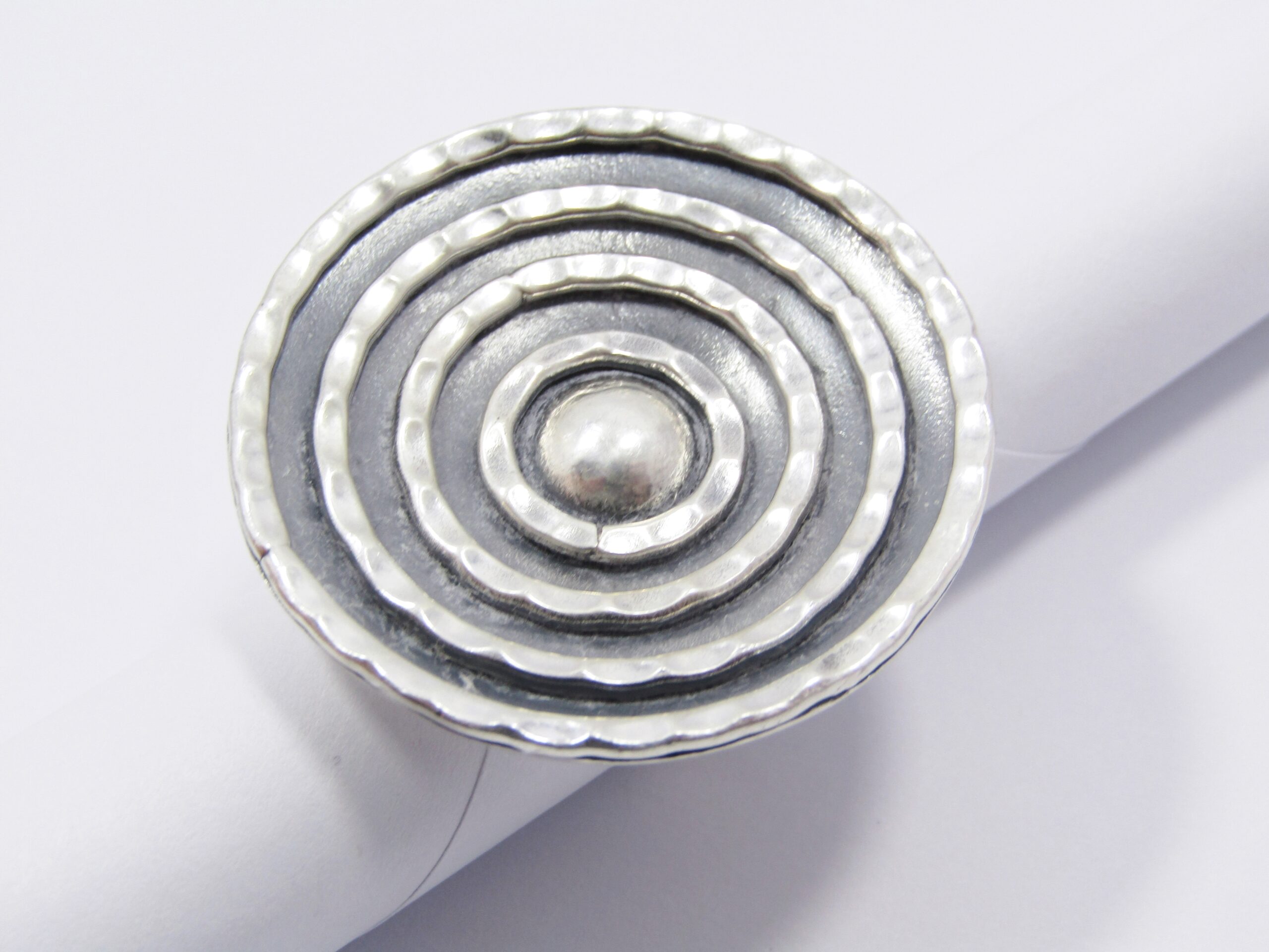 A Stunning Large Round Textured Ring with a Open-ended Band In Sterling Silver.