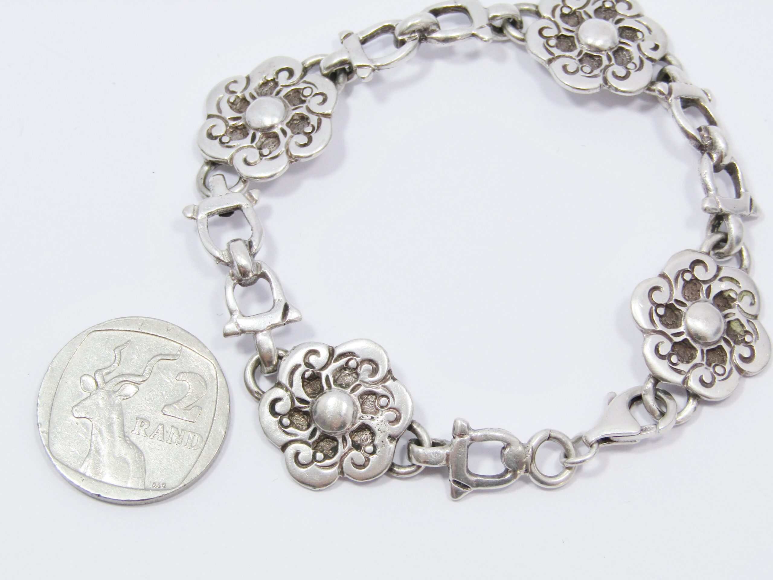 A Gorgeous Weighty Flower Bracelet in Sterling Silver.