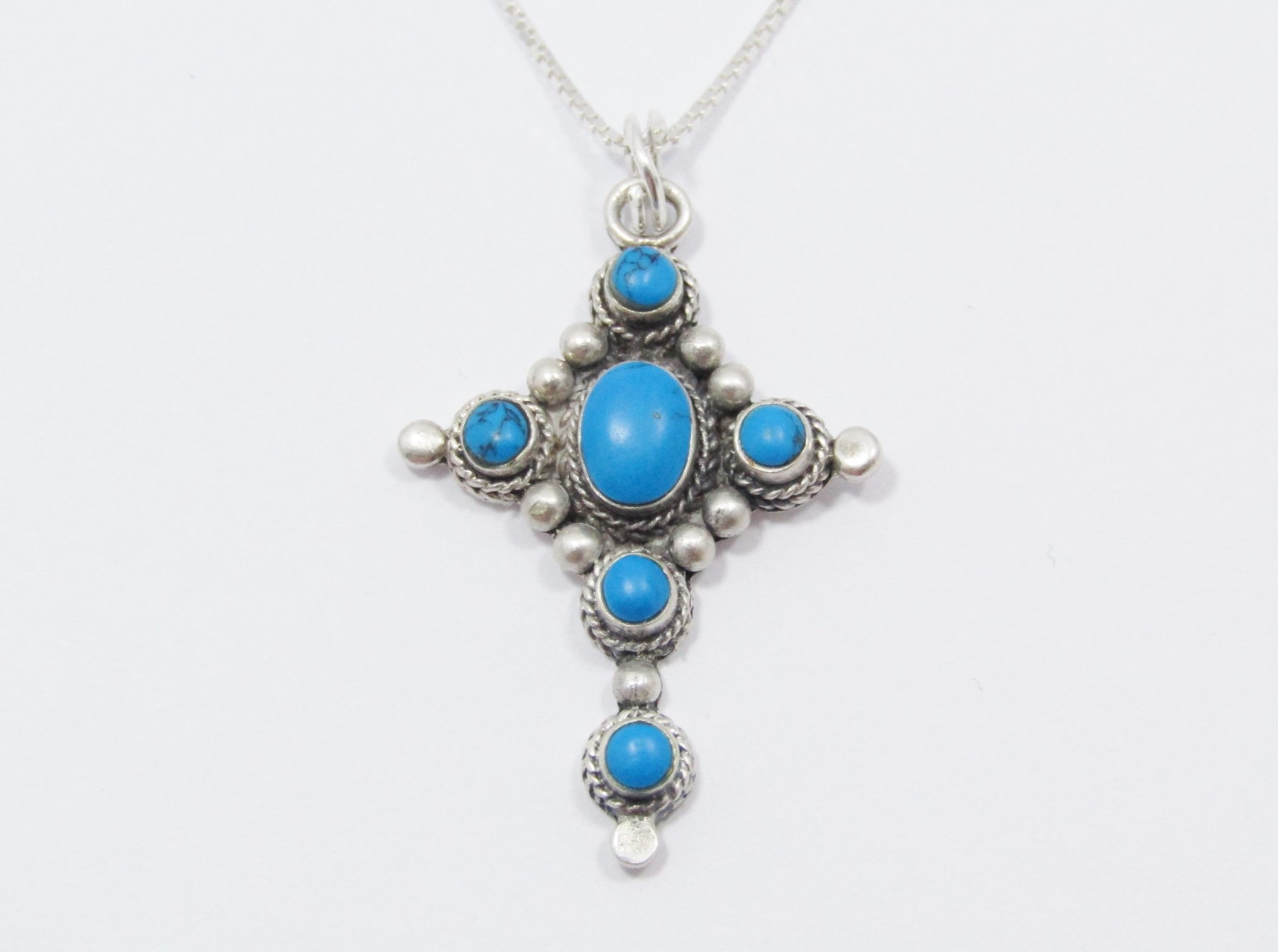 A Lovely Blue Stone Cross Pendant On Chain in Sterling Silver.