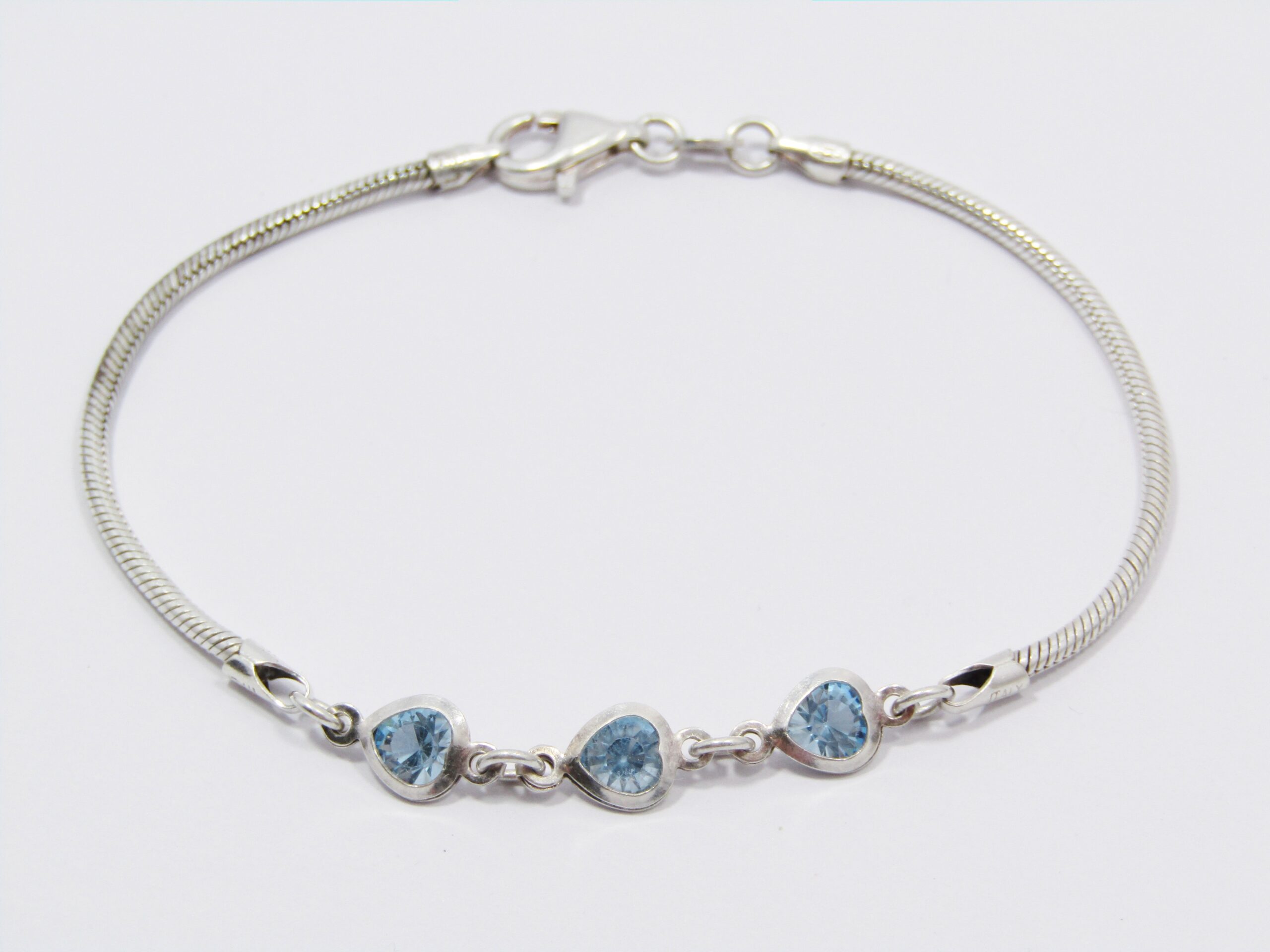 A Lovely Blue Heart Design Zirconia Bracelet in Sterling Silver.