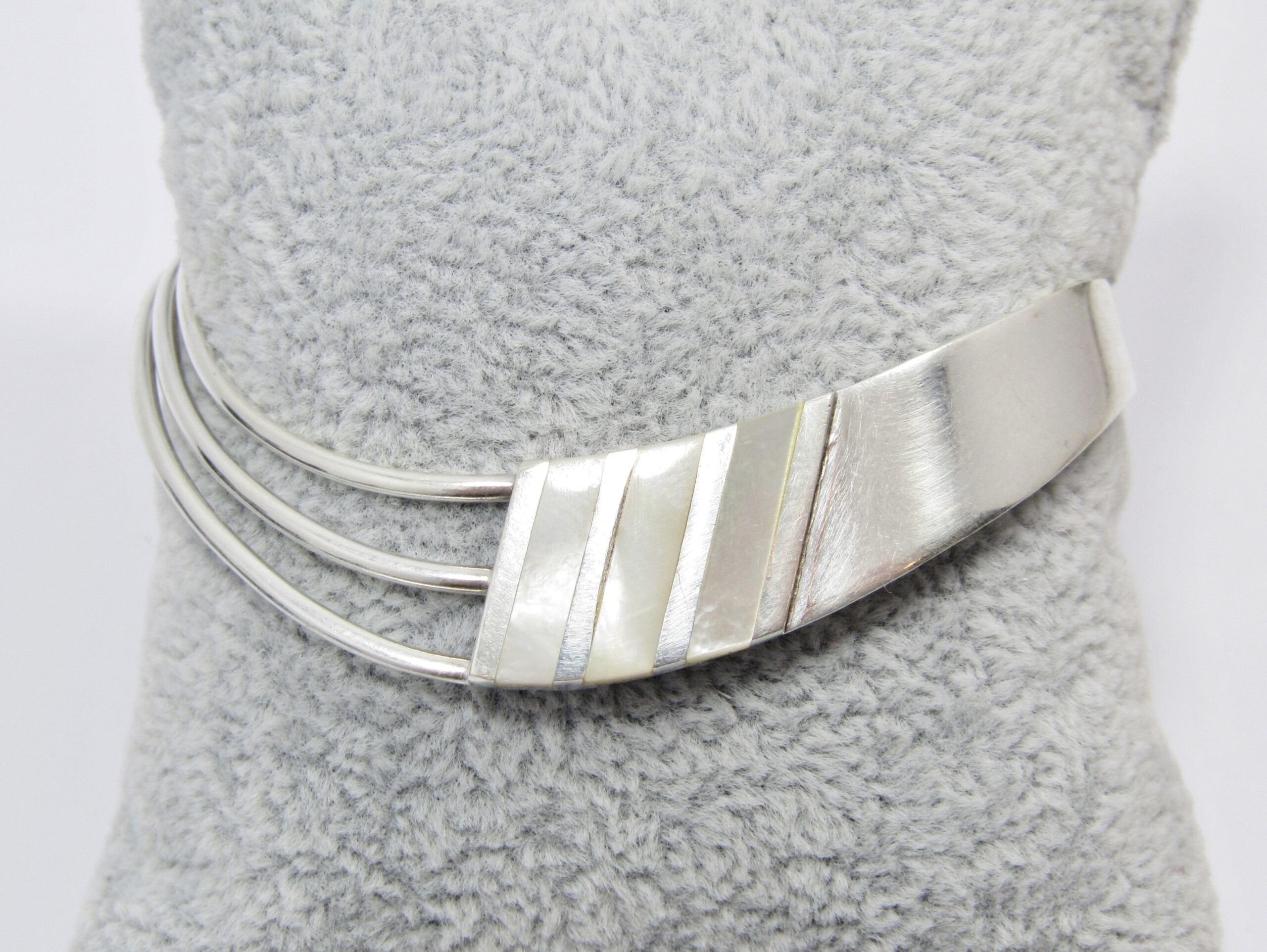 A Stunning Fancy Design Cuff Bangle With a Mother of Pearl Inlay in Sterling Silver.