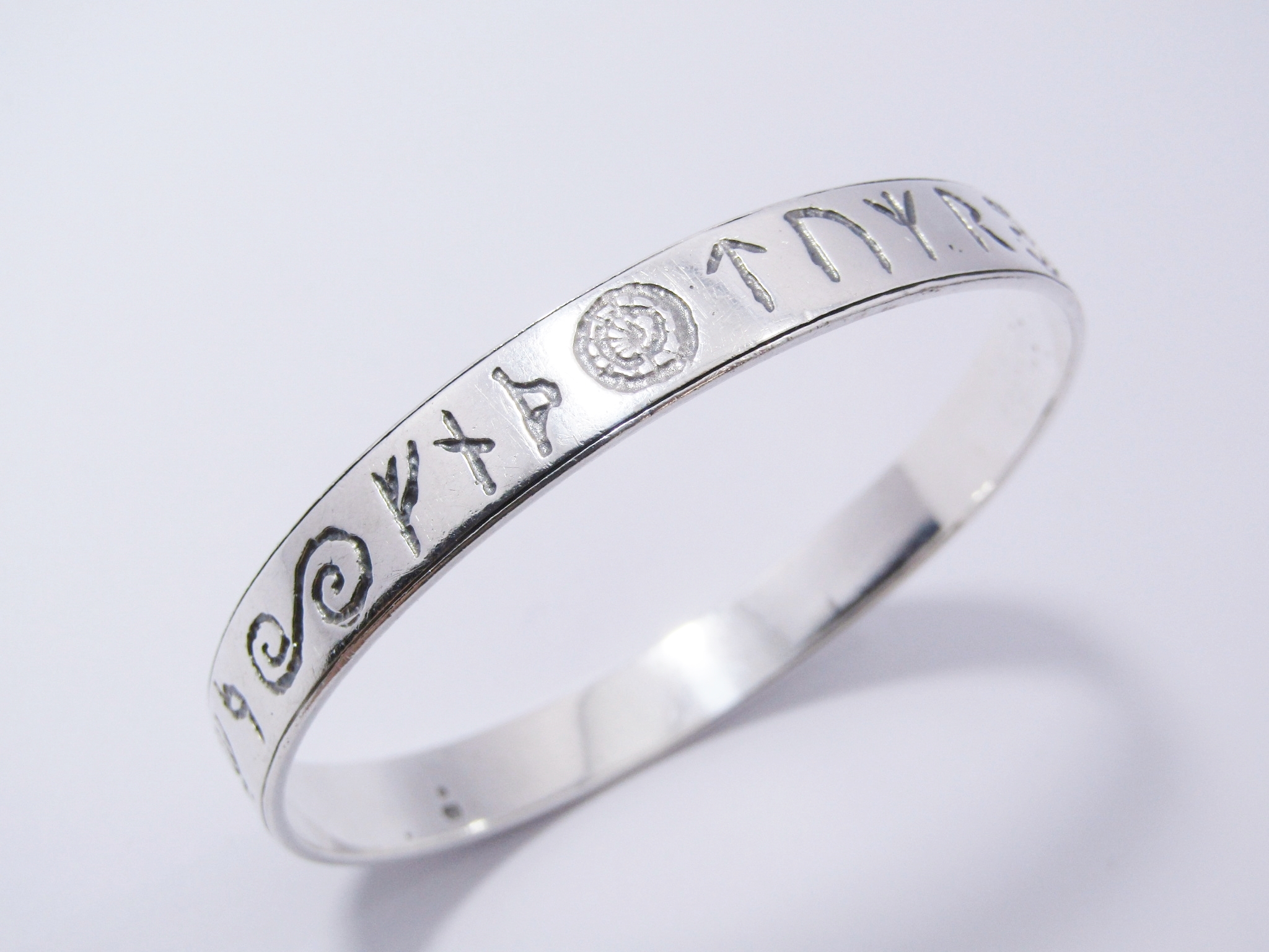 A Stunning Rustic Runic Design Bangle in Sterling Silver.