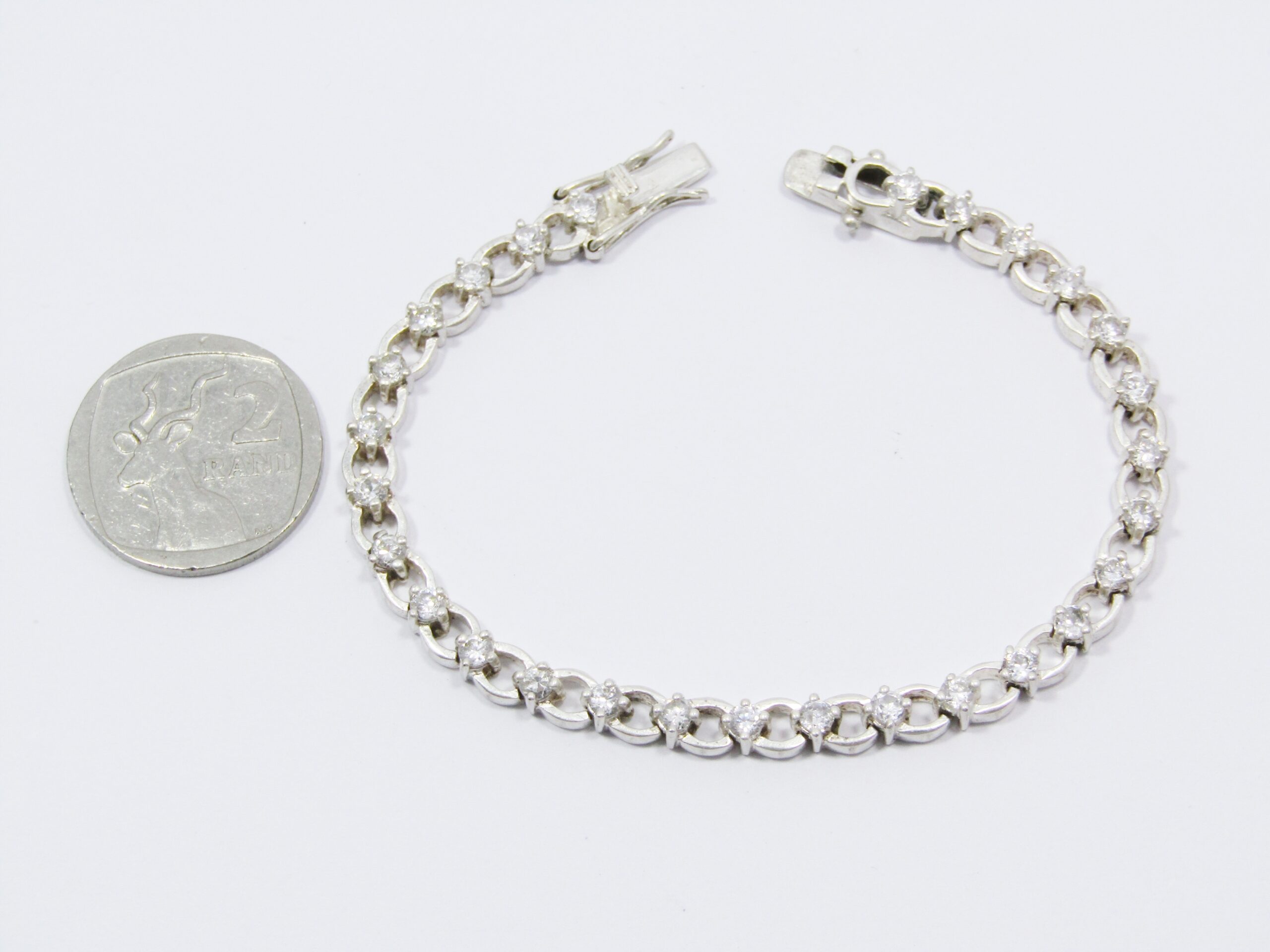 A Gorgeous Fancy Link Tennis Bracelet With Clear Zirconia’s in Sterling Silver