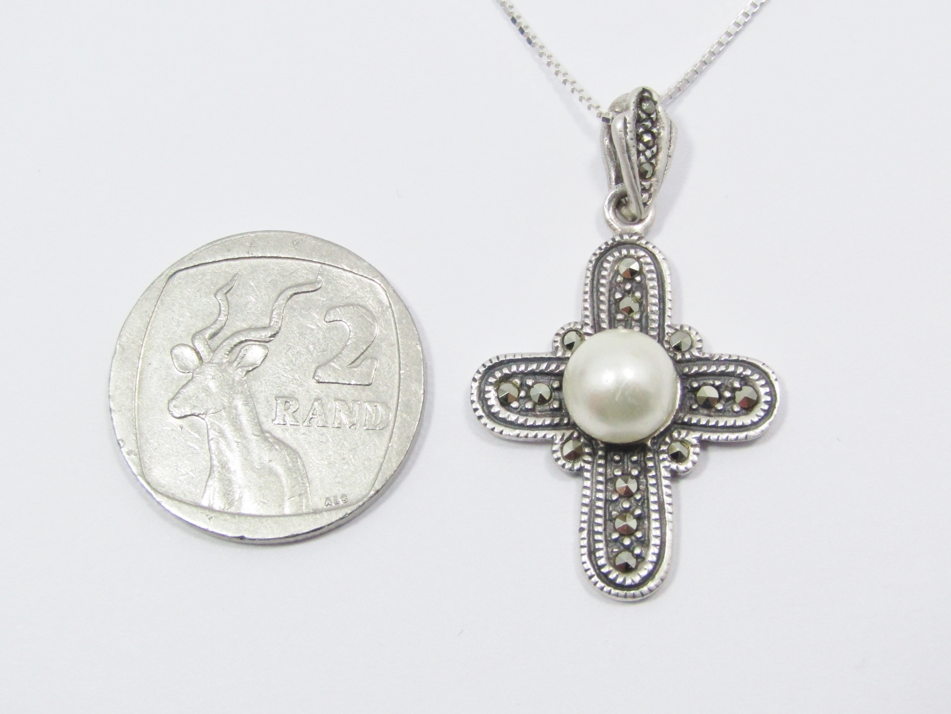 A Lovely Fresh Water Pearl and Marcasite Cross On Chain in Sterling Silver.