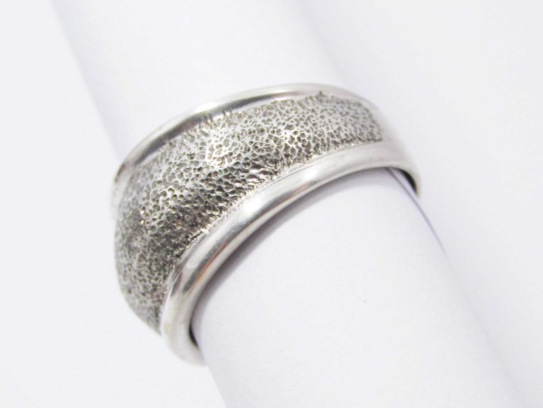 A Stunning Textured Band With a Slight Dome Design in Sterling Silver.