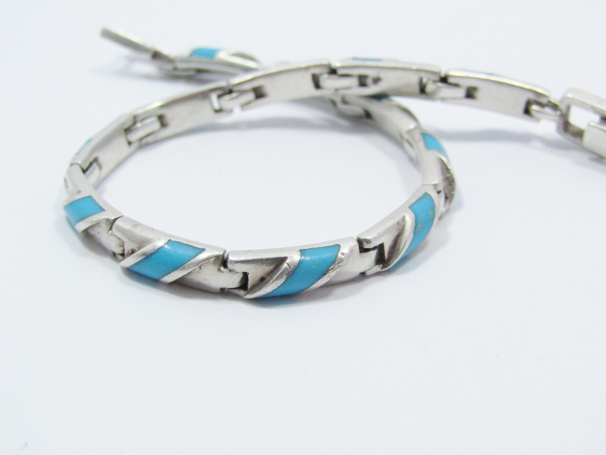 A Gorgeous Paneled Bracelet With a Turquois Inlay in Sterling Silver.