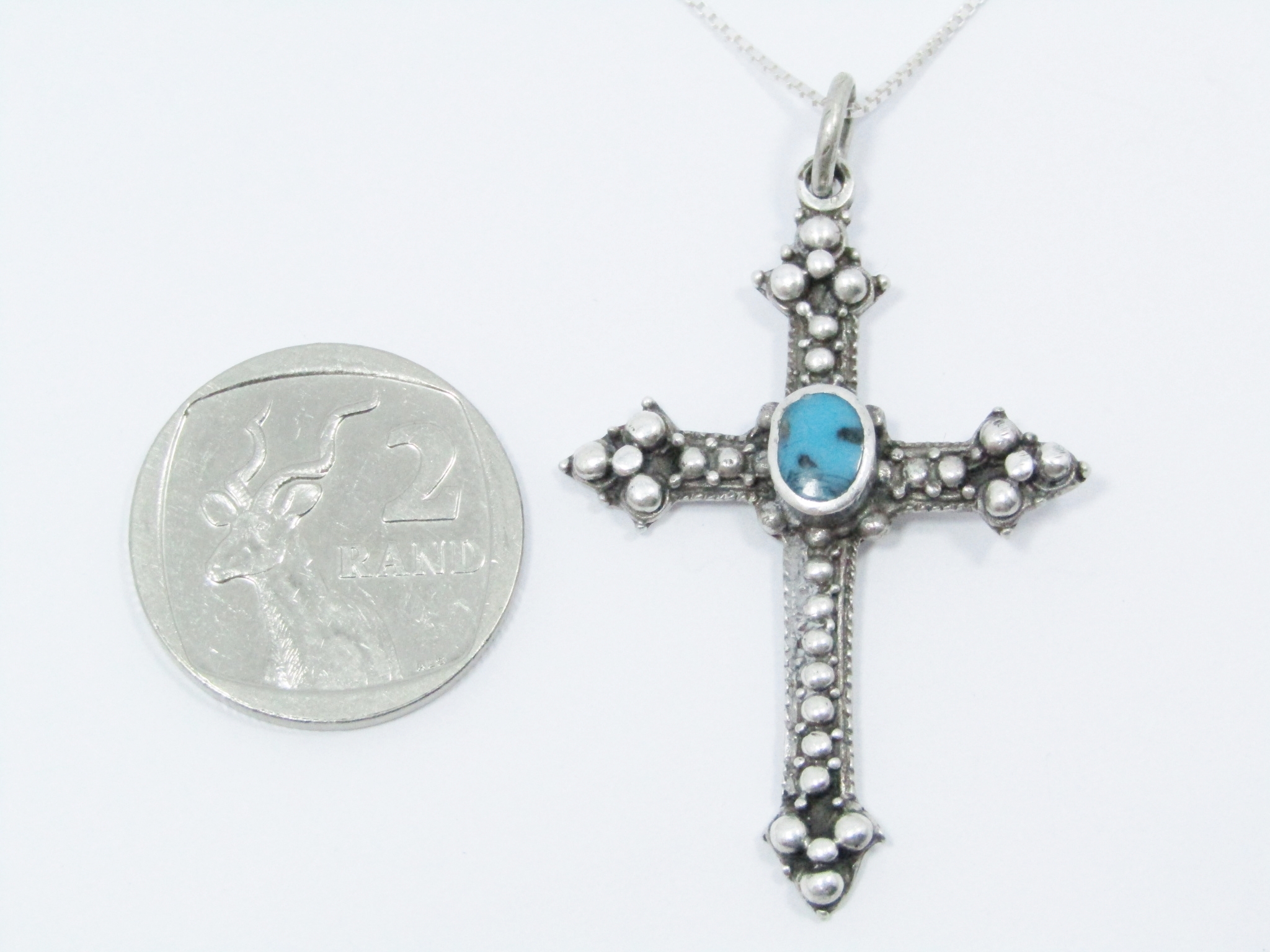 A Gorgeous Detailed Turquois Cross On Chain in Sterling Silver.