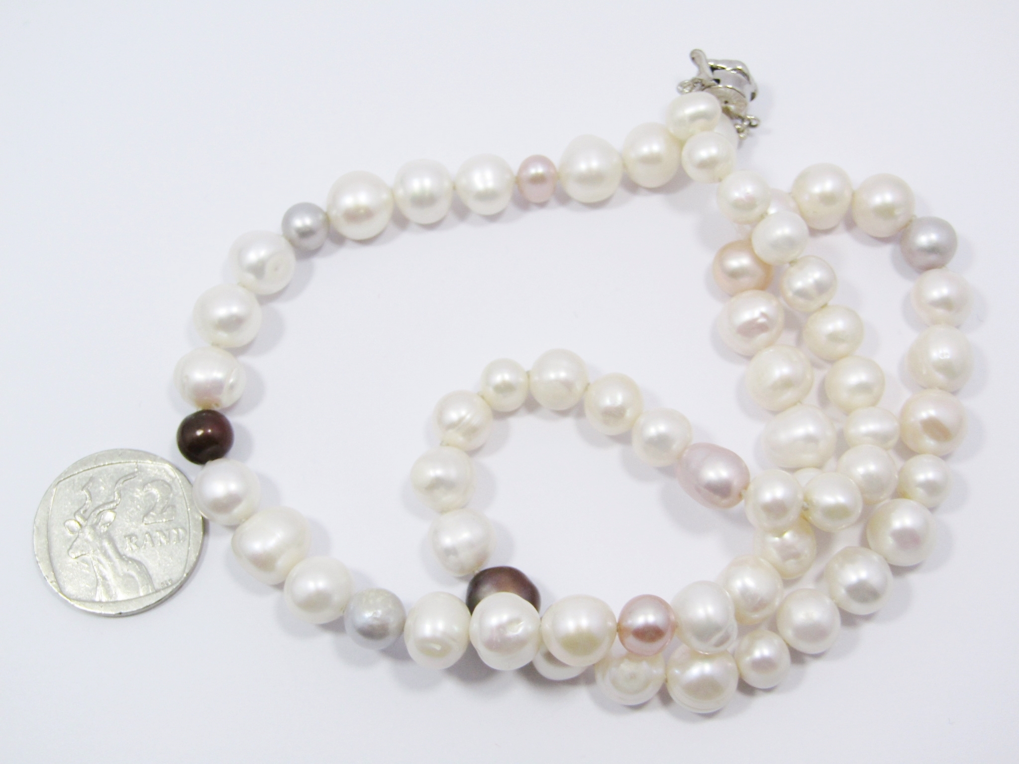 A Gorgeous String Of Fresh Water Pearls With a Sterling Silver Clasp