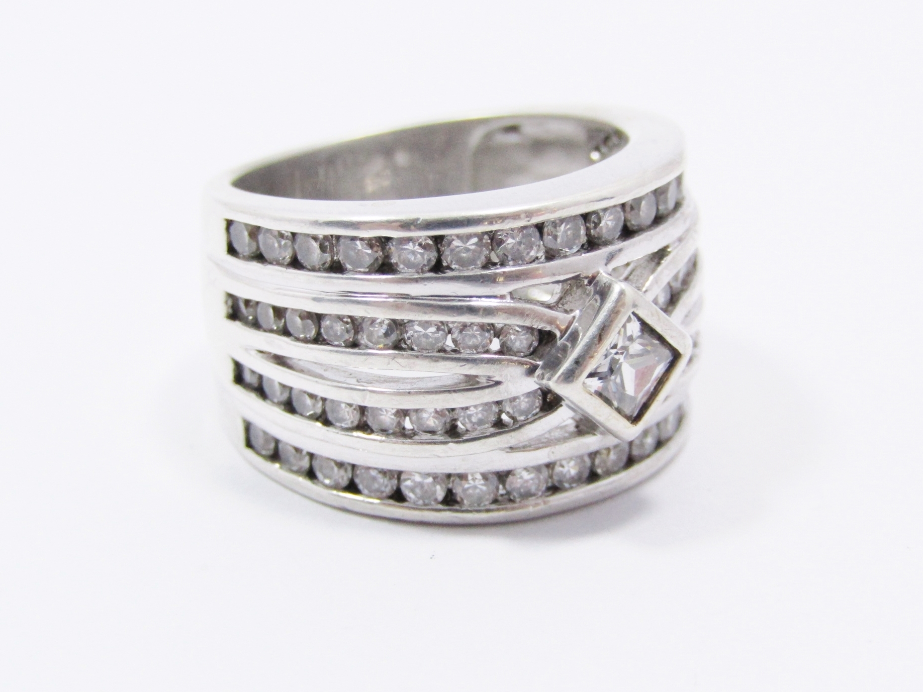 An Amazing Broad Four Band Into One Zirconia Ring in Sterling Silver.