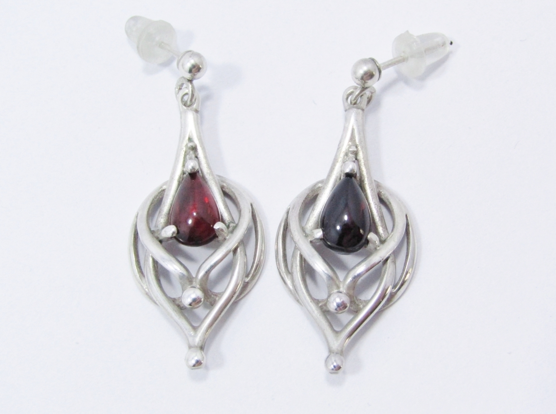 A Gorgeous Pair of Celtic Design Garnet Dangling Earrings in Sterling Silver.