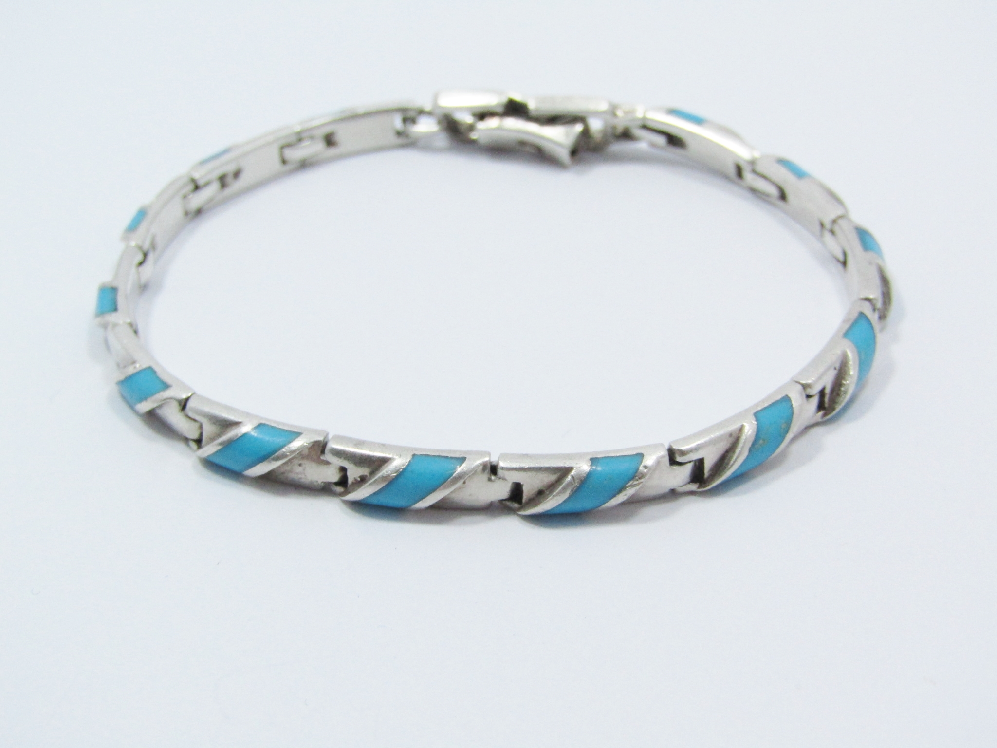 A Gorgeous Paneled Bracelet With a Turquois Inlay in Sterling Silver.