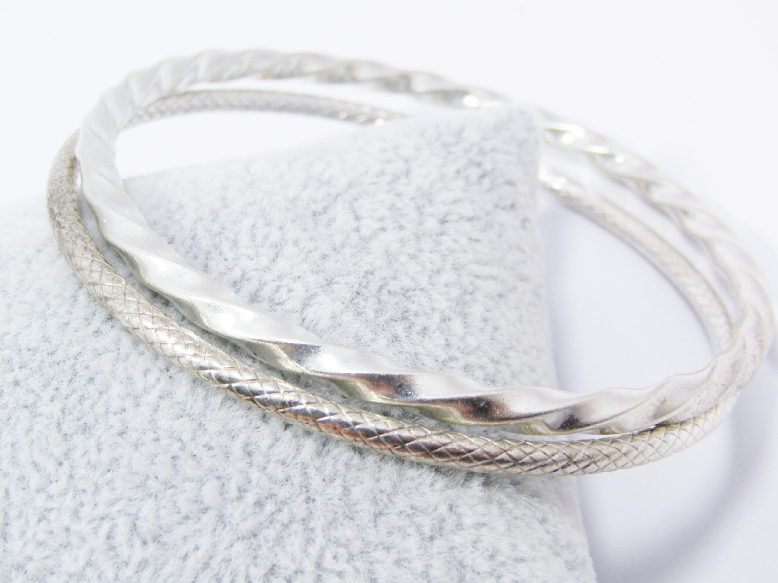 Two Lovely Textured Stack Bangles in Sterling Silver.