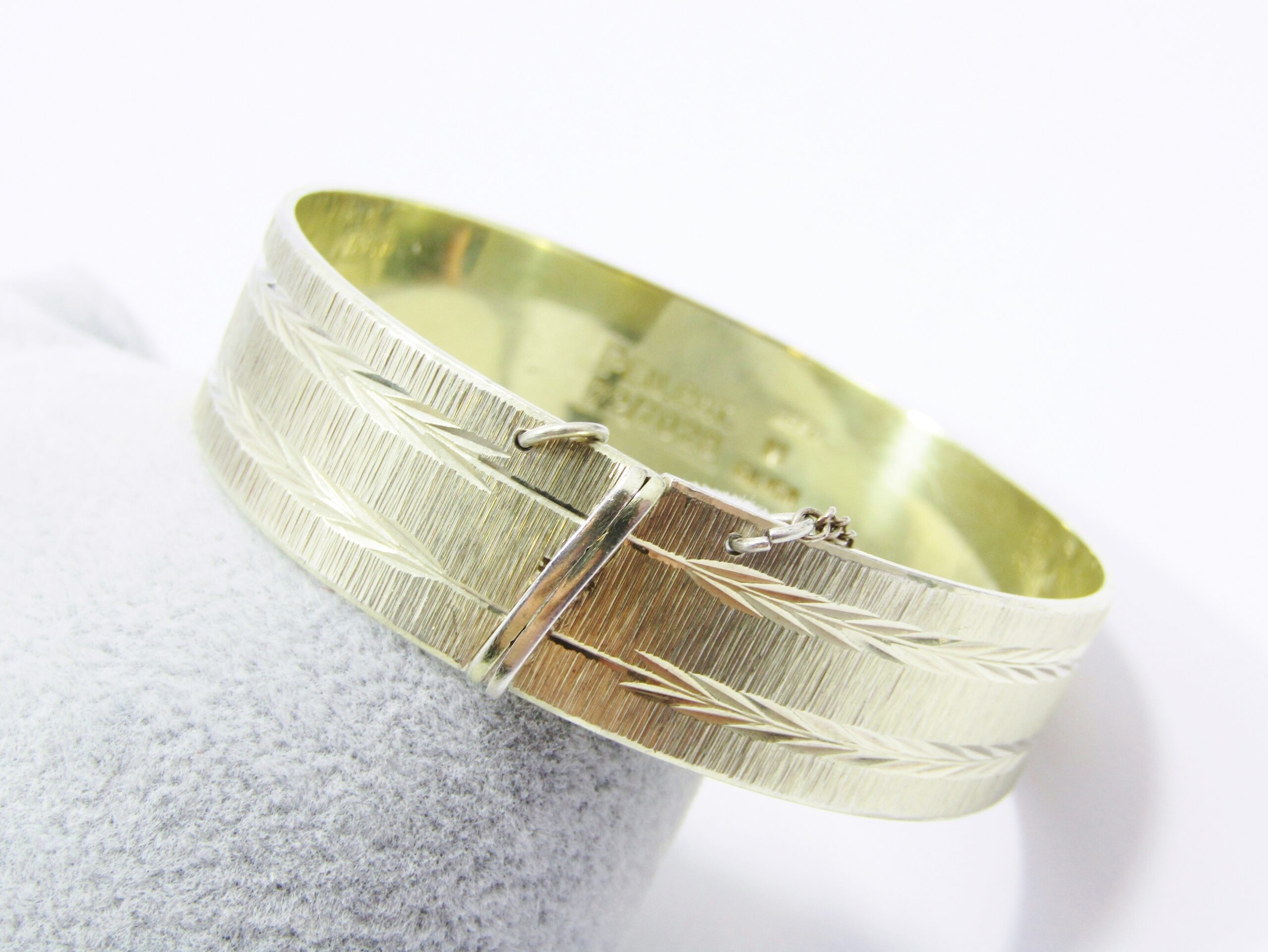A Beautiful Textured Gold Gilt Over Sterling Silver Hinged Bangle in Sterling Silver.