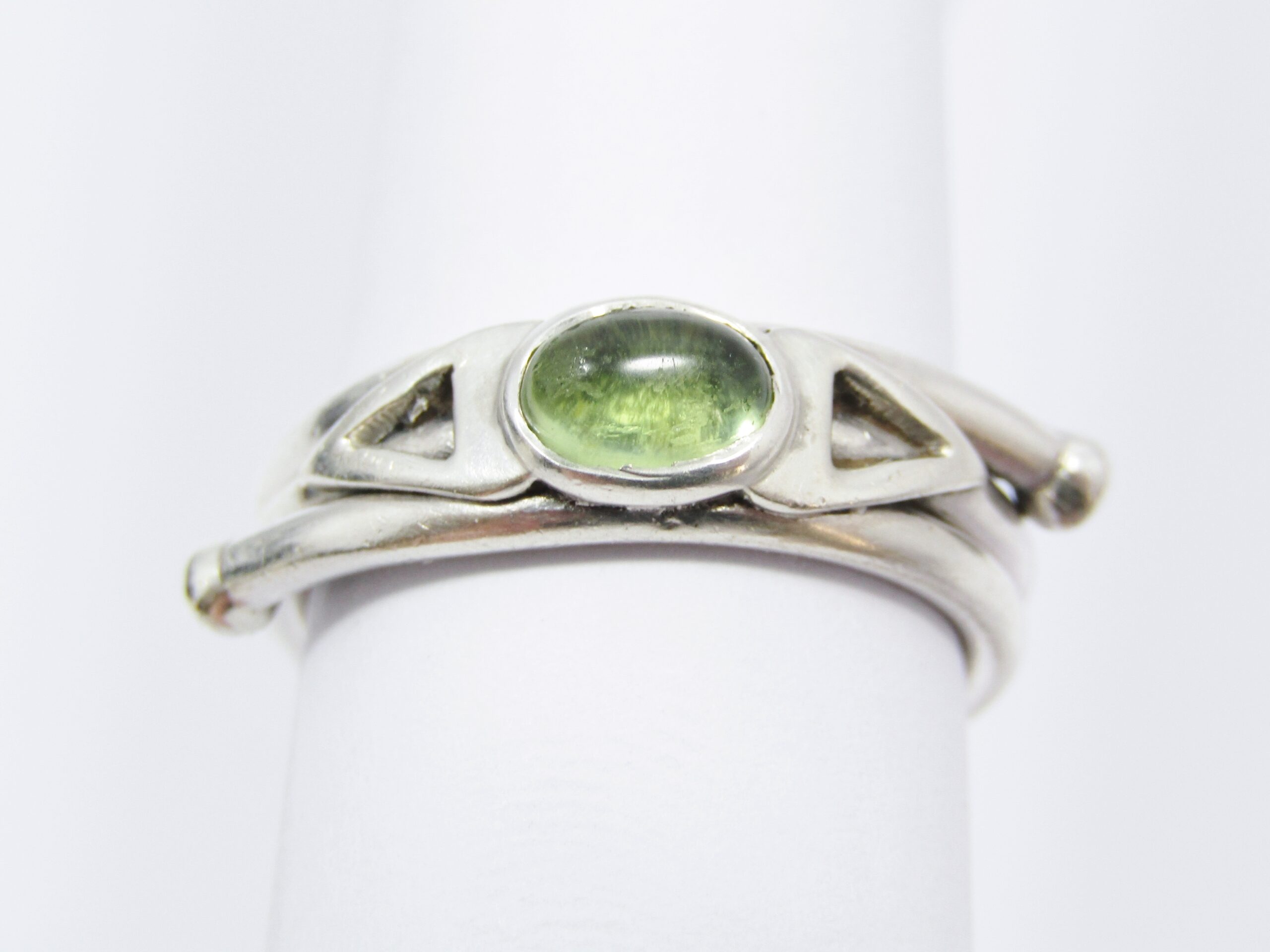 A Bespoke Wrap Around Rand Ring With a Cabochon Peridot Ring in Sterling Silver