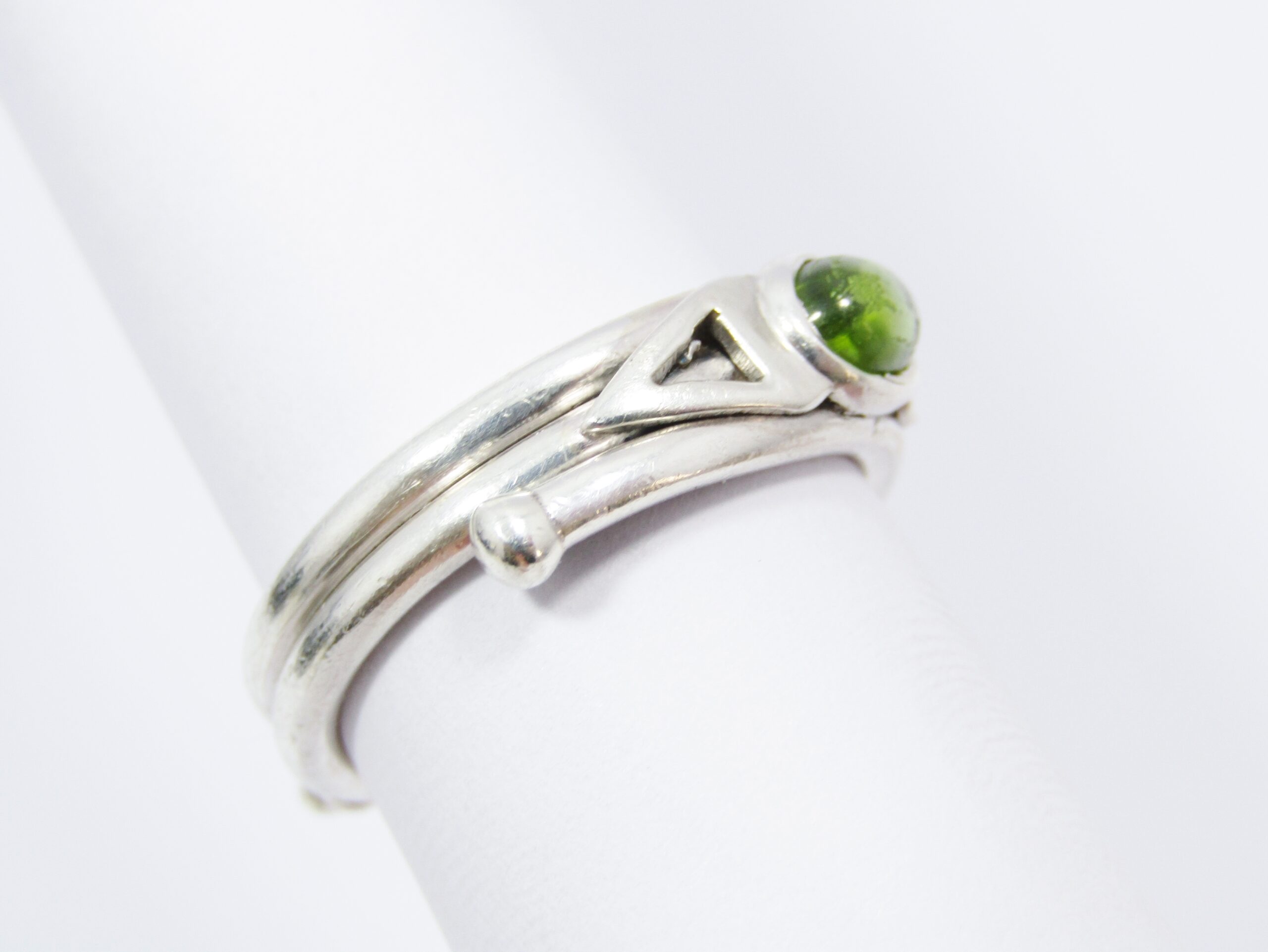 A Bespoke Wrap Around Rand Ring With a Cabochon Peridot Ring in Sterling Silver