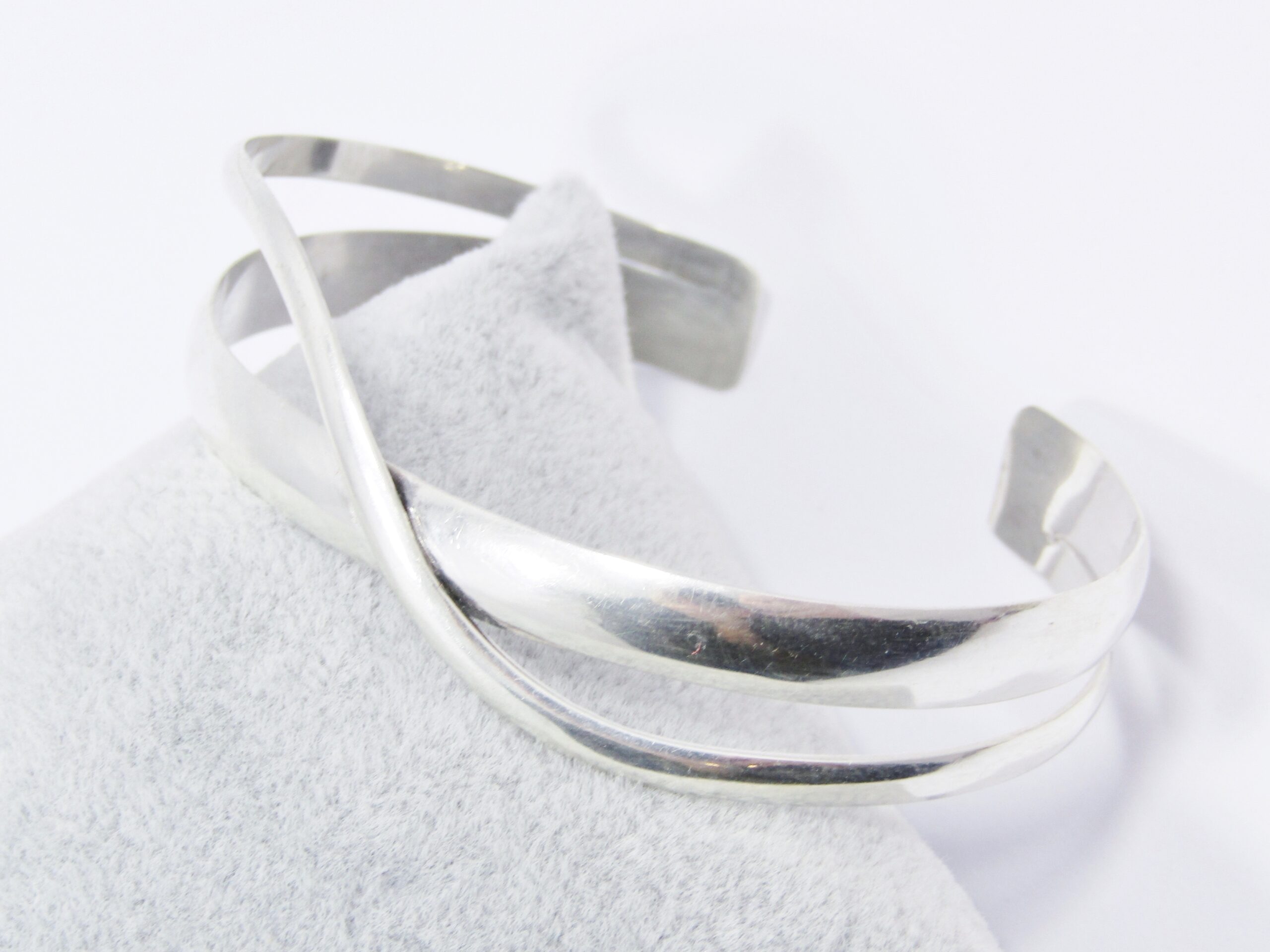 A Stunning Cross Over Design Cuff Bangle in Sterling Silver.