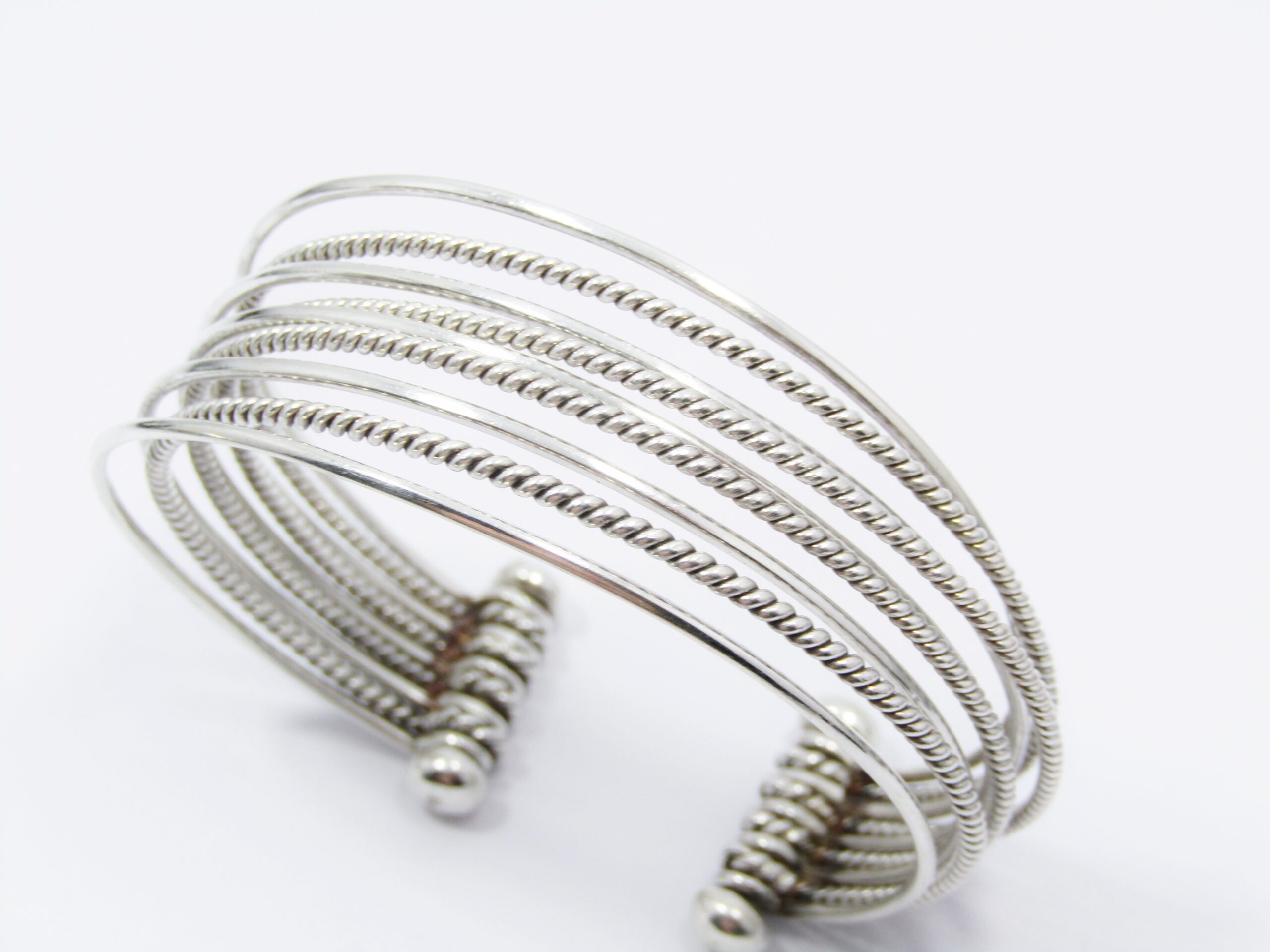 A Spectacular 9 Strand Cuff Bangle in Sterling Silver.