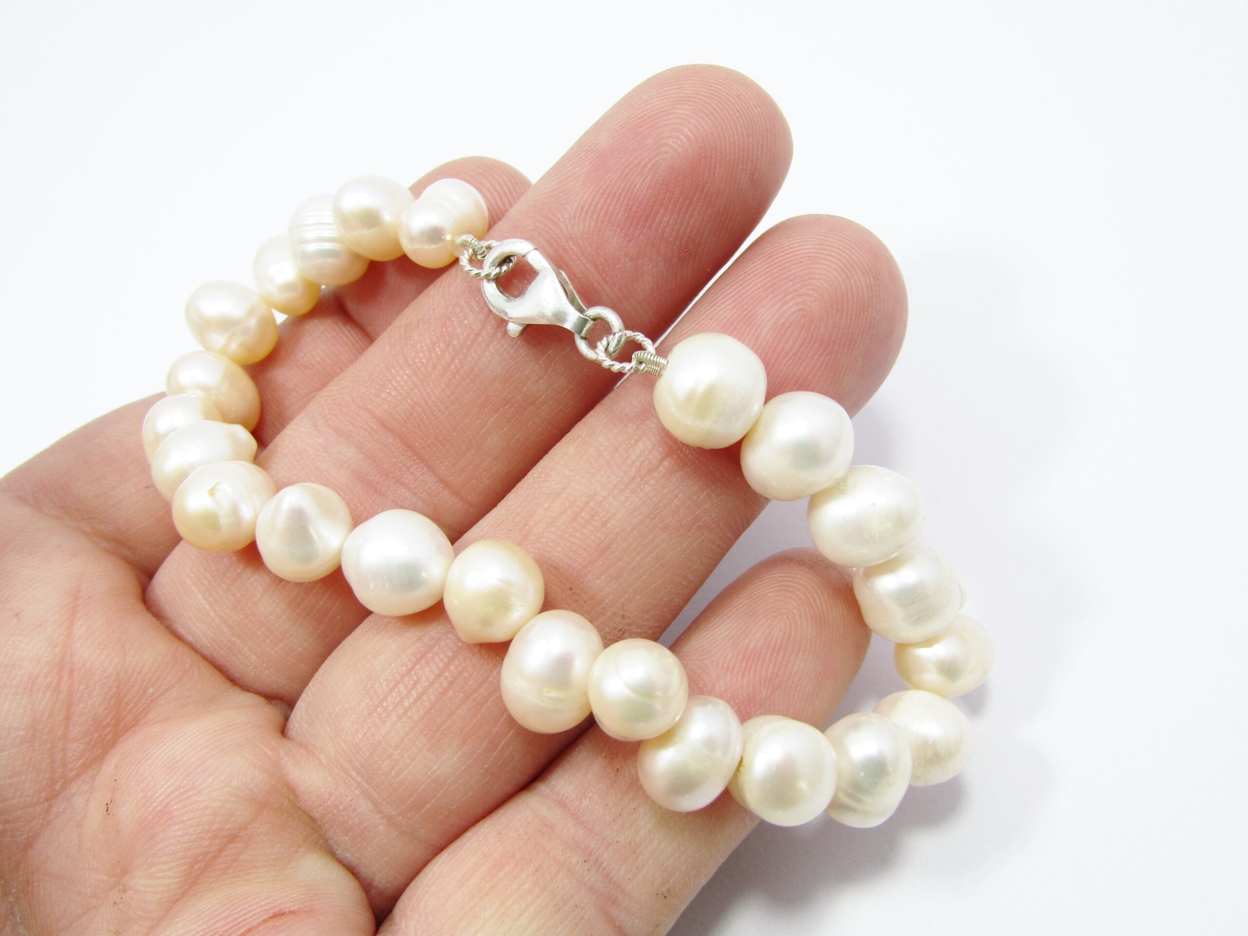 A Lovely Broad Fresh Water Pearl Bracelet with a Sterling Silver Clasp.