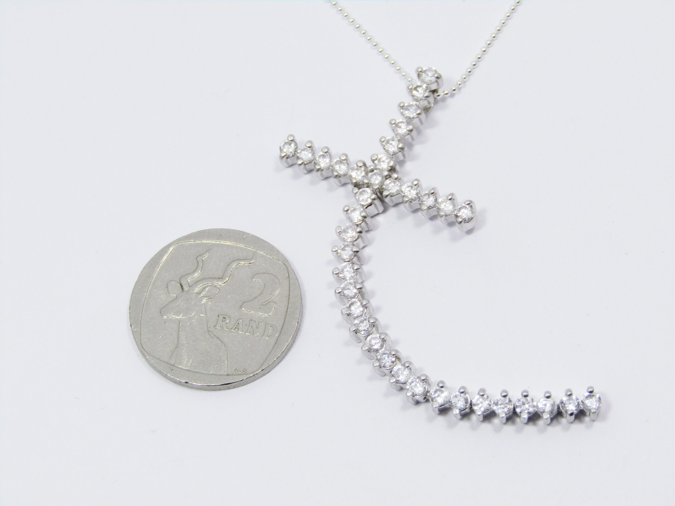 A Beautiful Long Zirconia Cross On Chain in Sterling Silver.