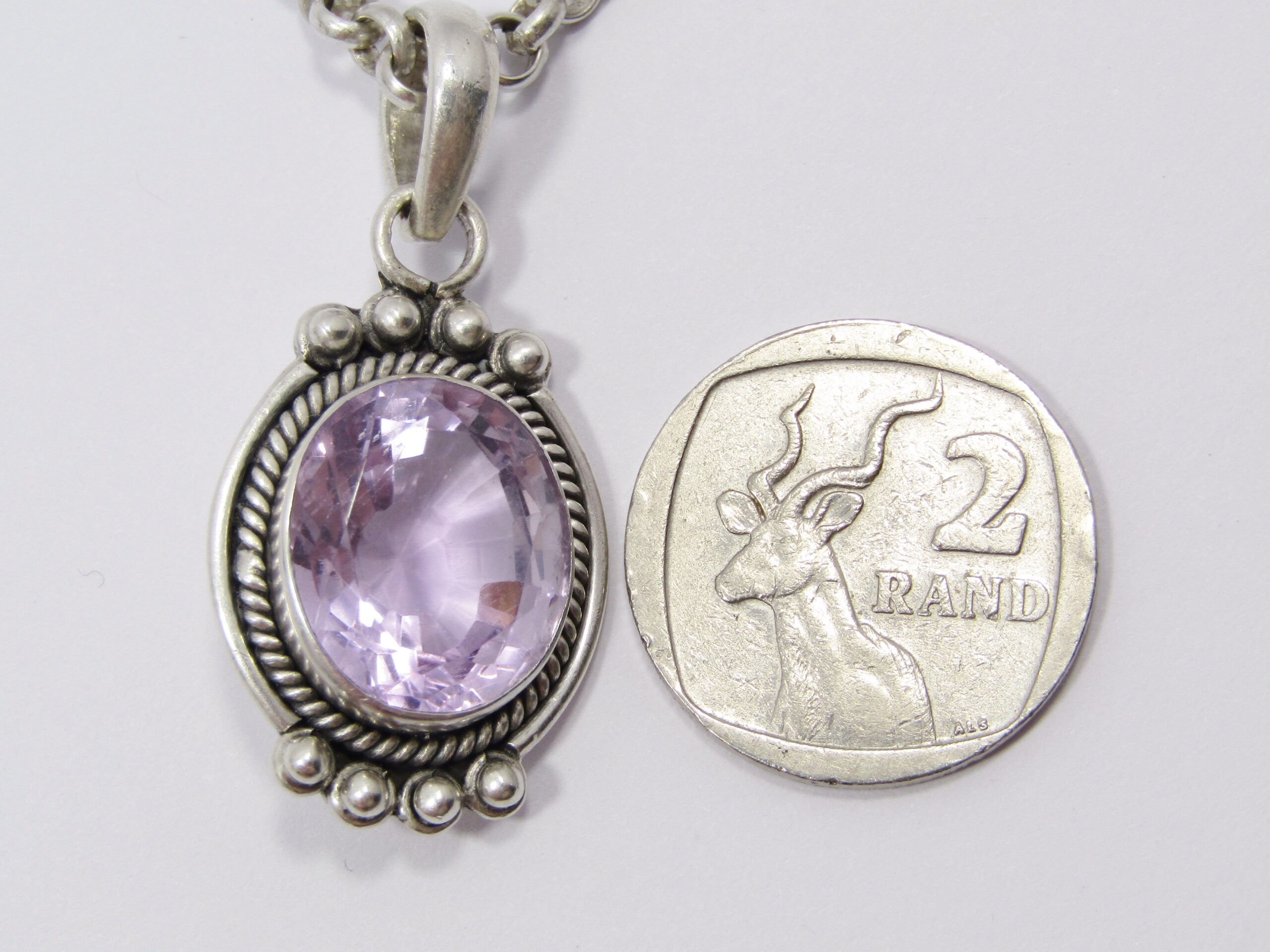 A Beautiful Chunky Amethyst Pendant on a Thicker Gauge Round Link Necklace in Sterling Silver.