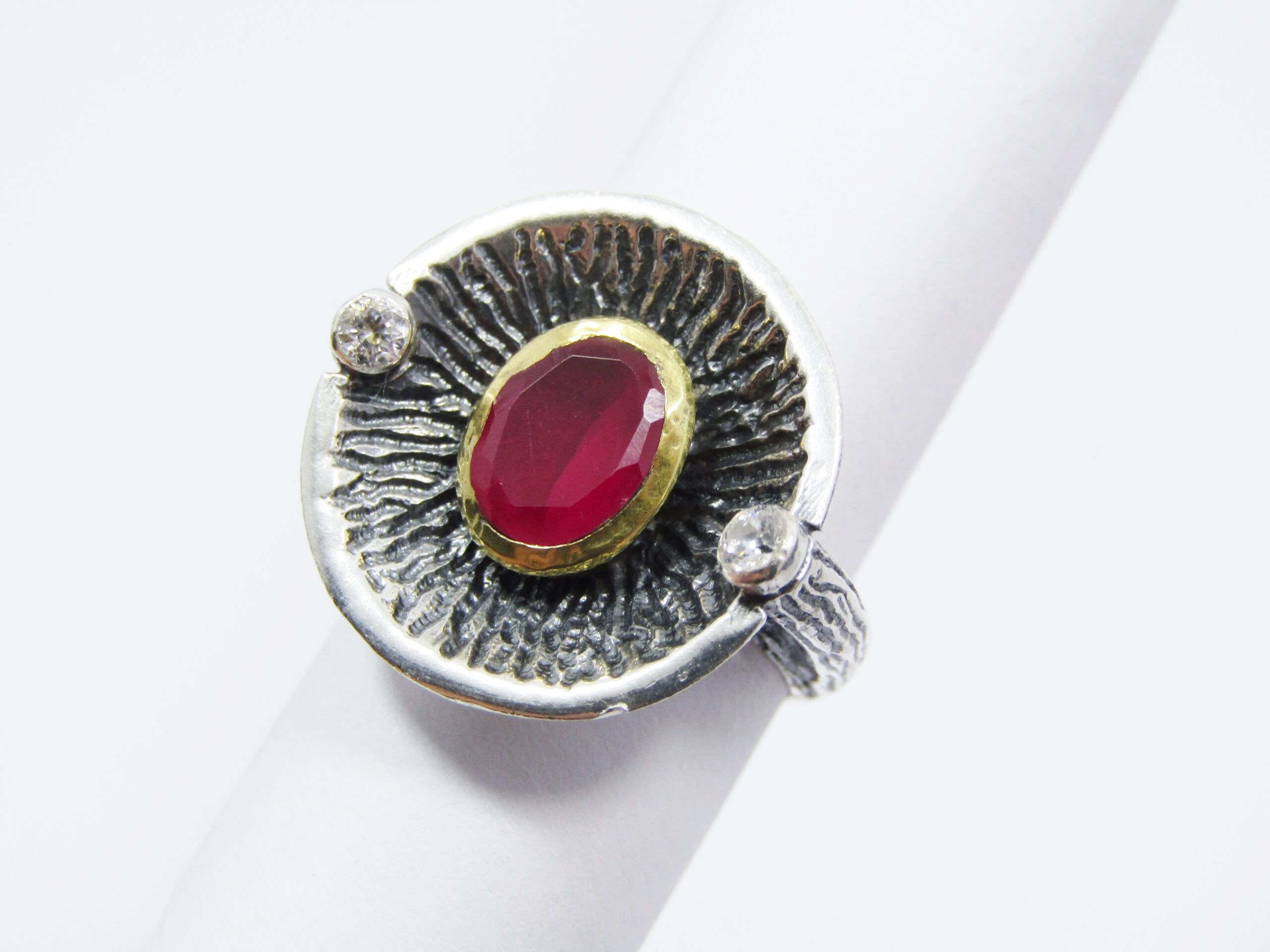 A Stunning Two Tone Brass over Sterling Silver ring with a Synthetic Ruby in Sterling Silver.