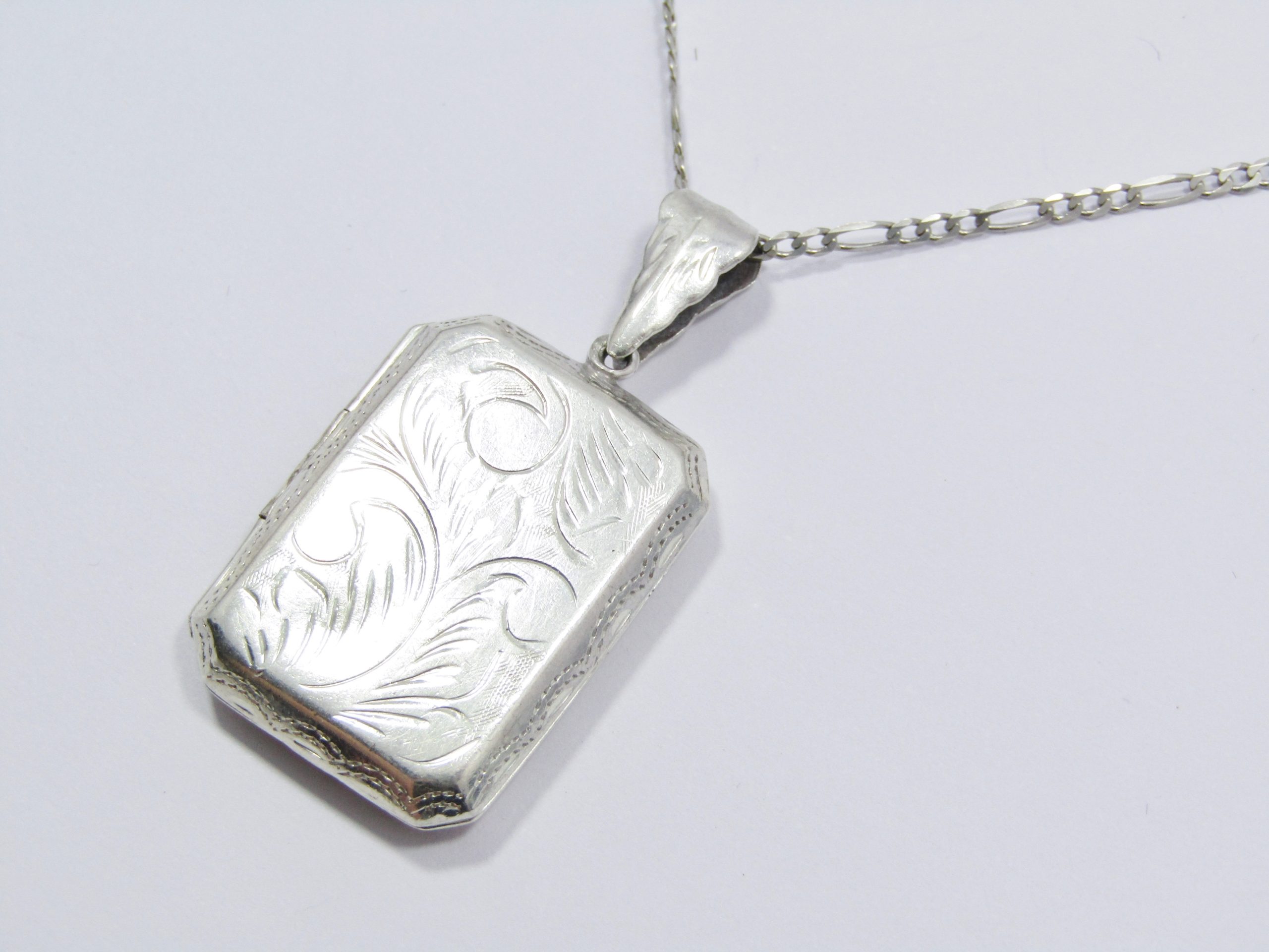 A Gorgeous Large Rectangular Engraved Locket On Chain in Sterling Silver.