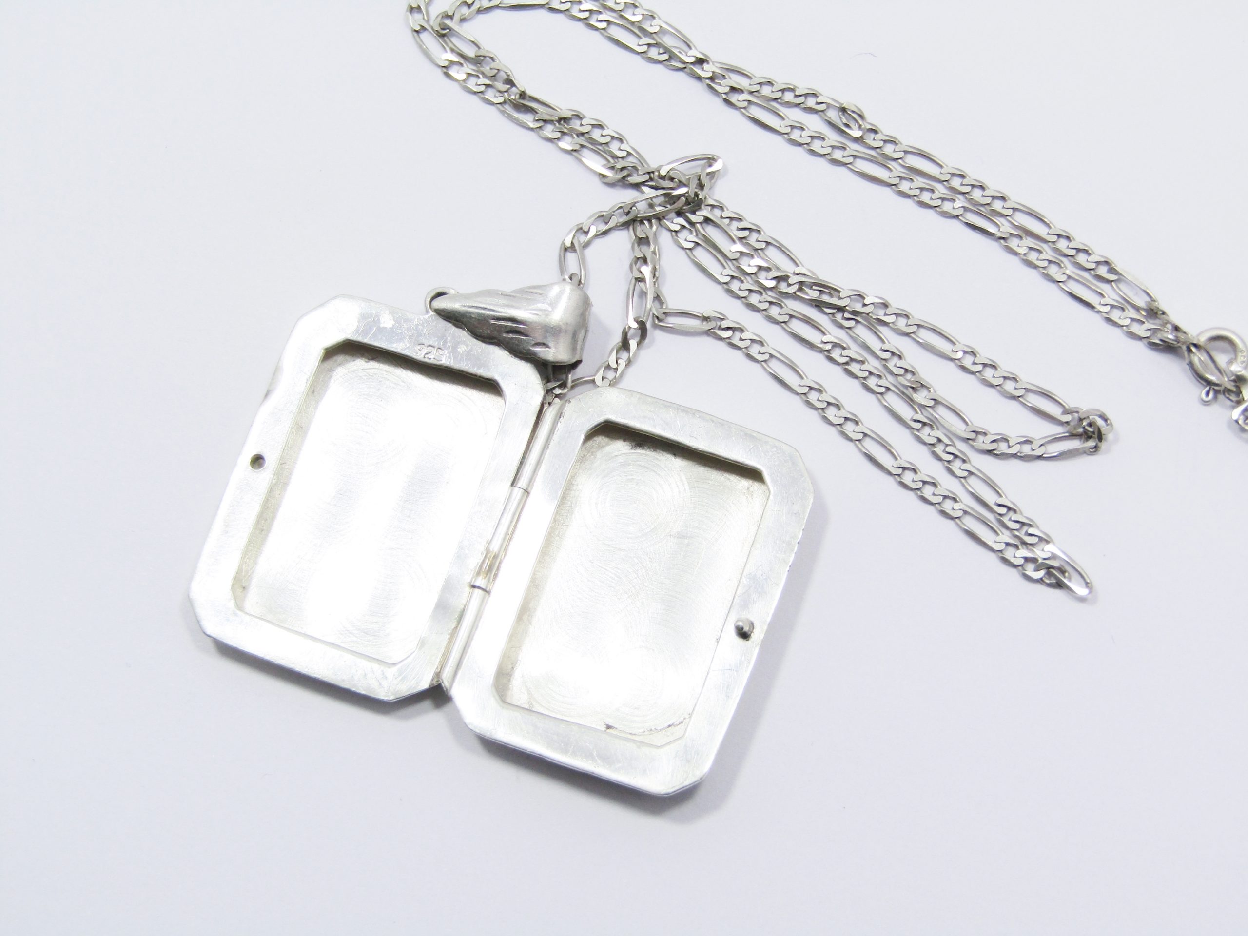 A Gorgeous Large Rectangular Engraved Locket On Chain in Sterling Silver.