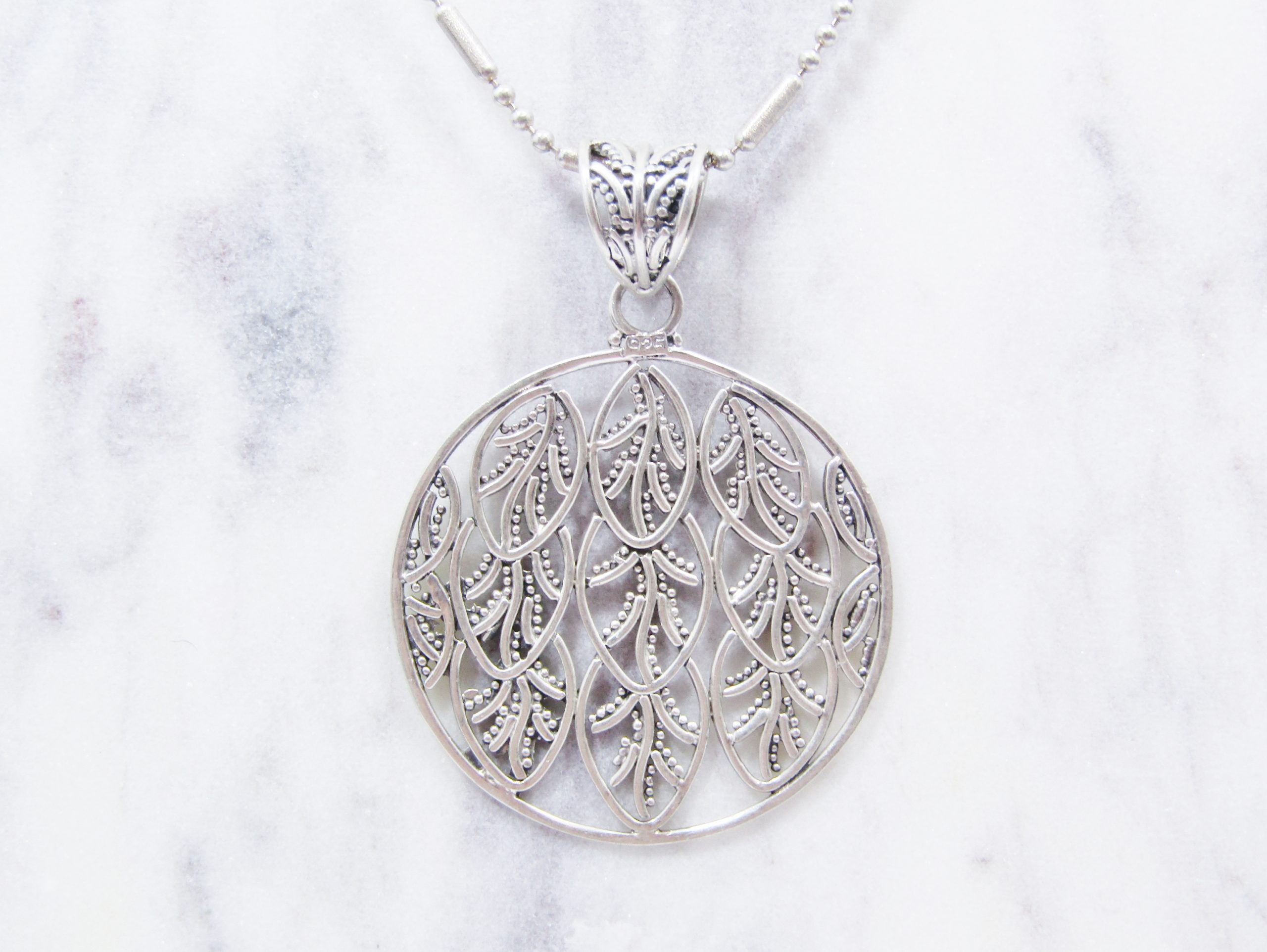 A Beautiful Large Round Leaf Design Pendant on Chain in Sterling Silver.
