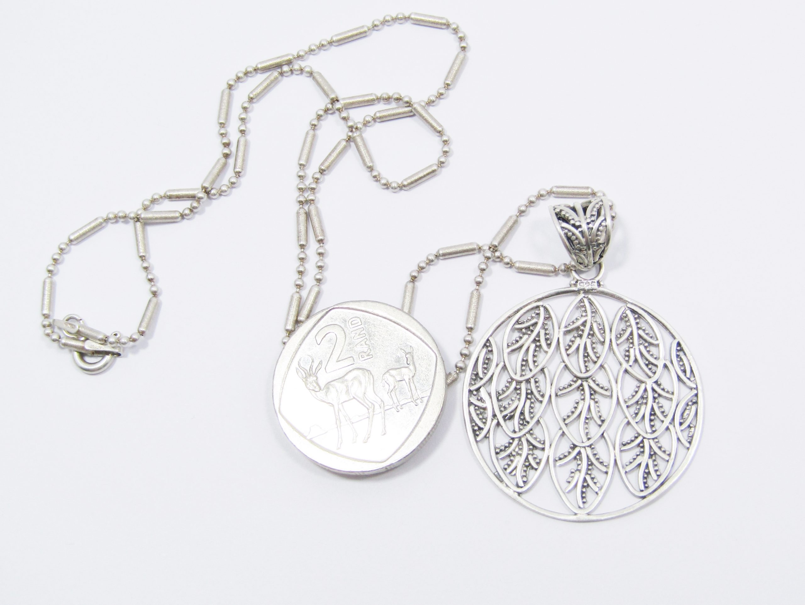 A Beautiful Large Round Leaf Design Pendant on Chain in Sterling Silver.