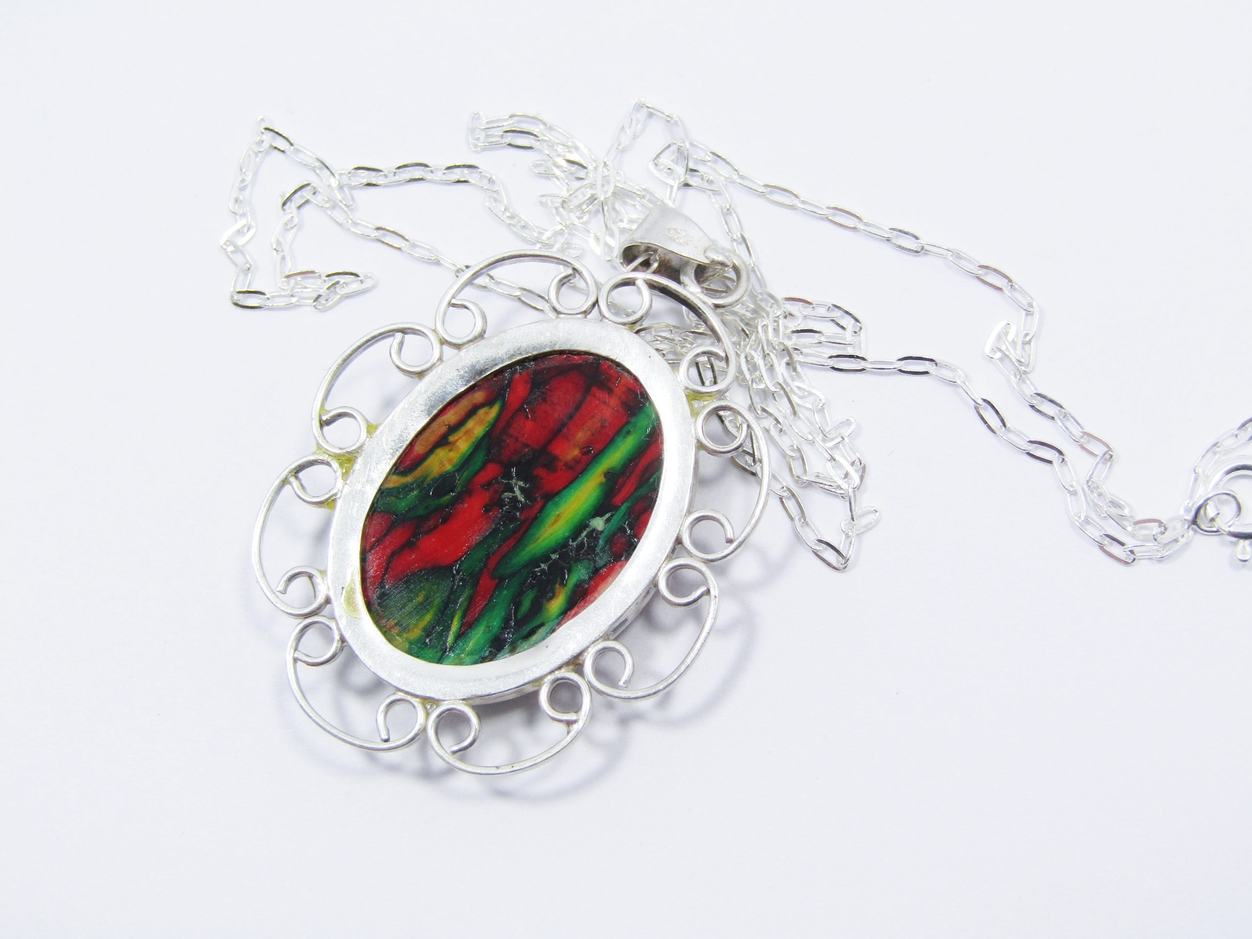 A Lovely Detailed Acrylic Pendant on Chain in Sterling Silver.