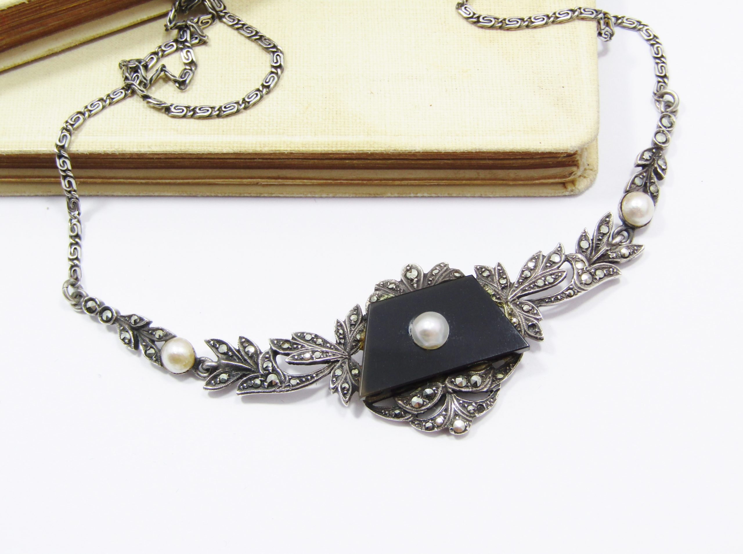A Gorgeous Vintage Design Onyx Set with a Cultured Pearl Dotted with Marcasite's in 935 Silver