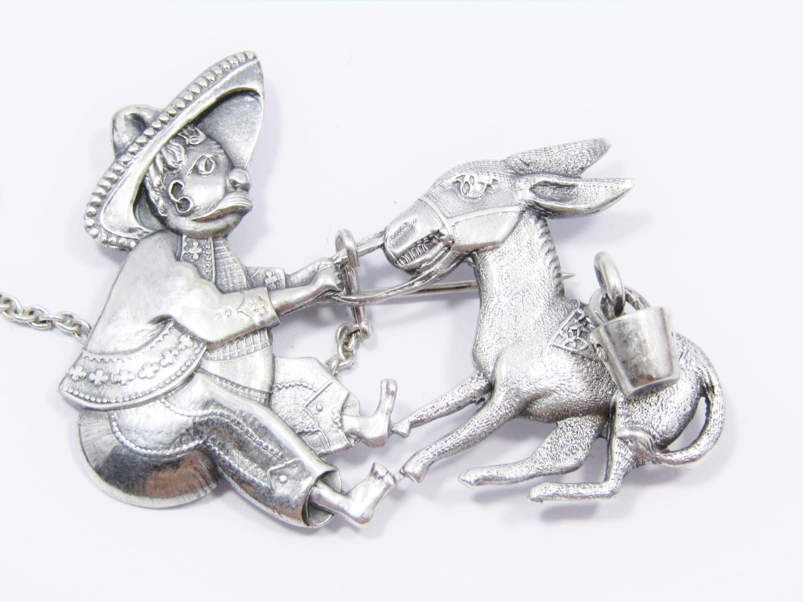 A Gorgeous and Oh So Different CANDIDA Mexican and the Donkey Brooch in Sterling Silver.