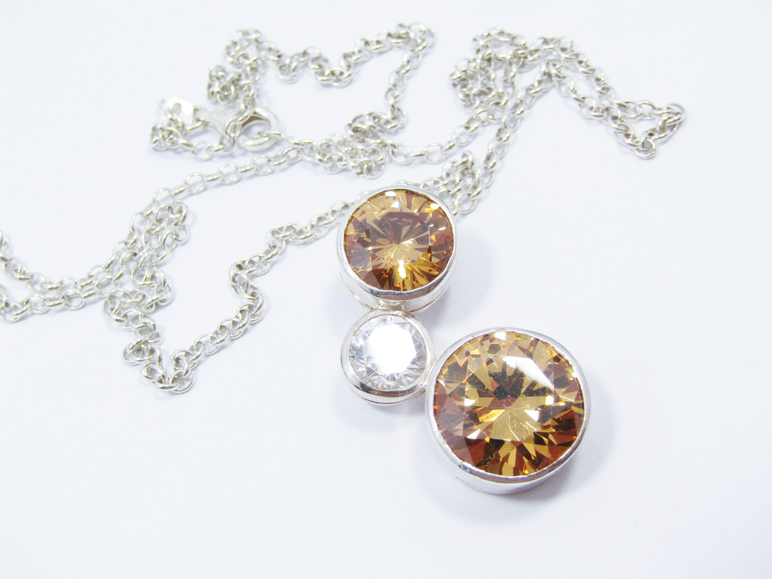 Beautiful Orange And Clear Zirconia Pendant On Chain in Sterling Silver