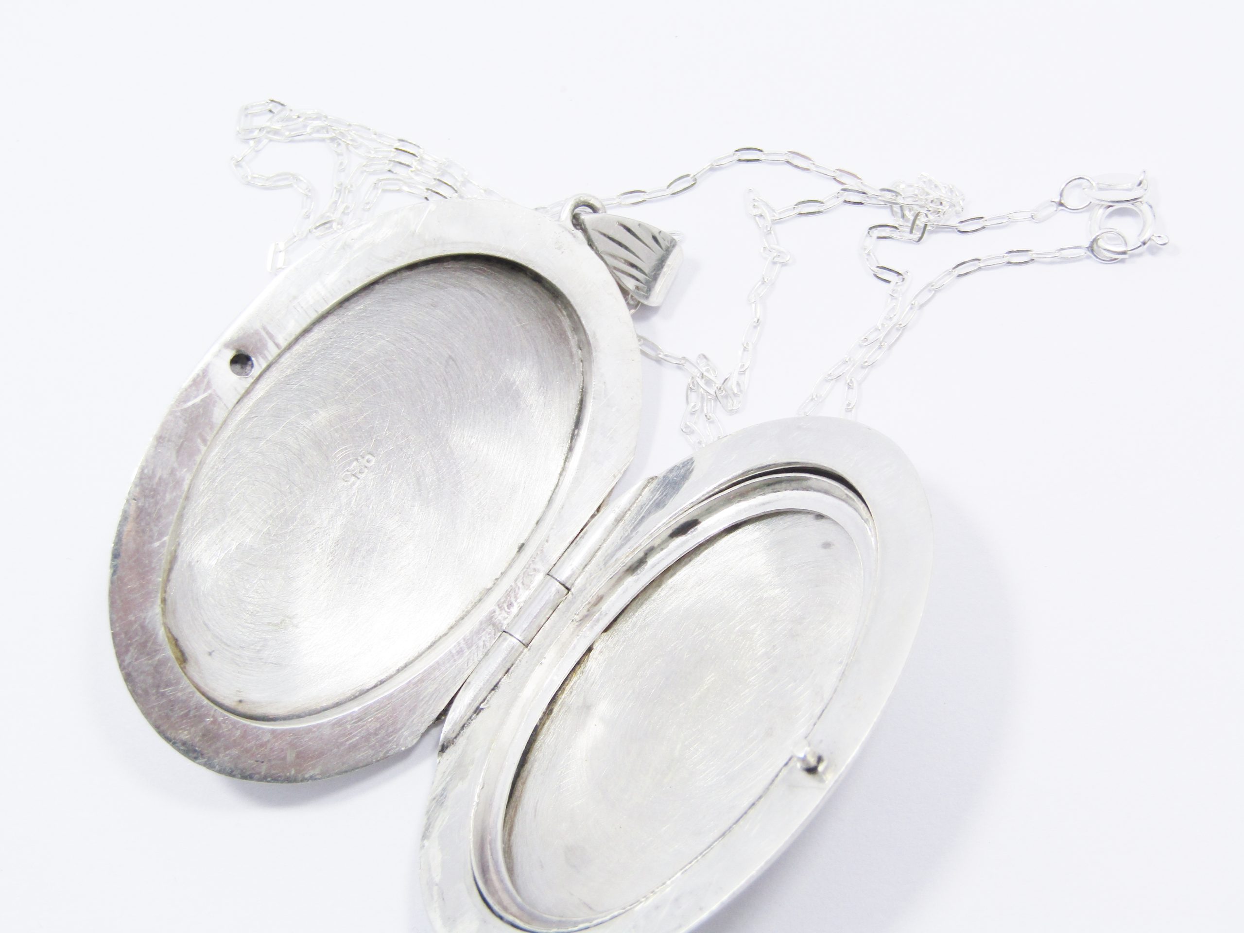 A Beautiful Vintage Design Large Oval Engraved Locket on Chain in Sterling Silver