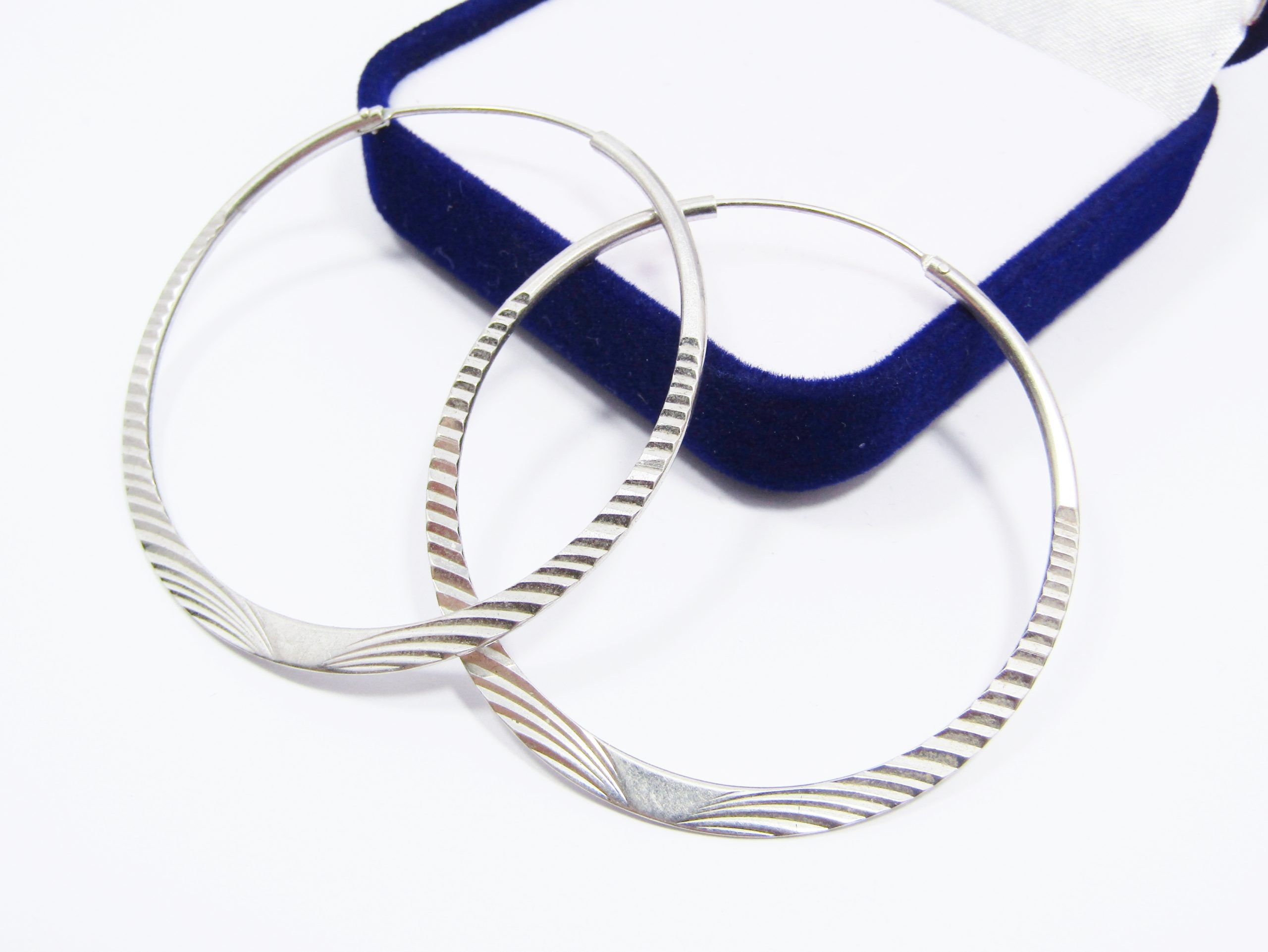 A Stunning pair of Textured Gypsy Hoop Earrings in Sterling Silver