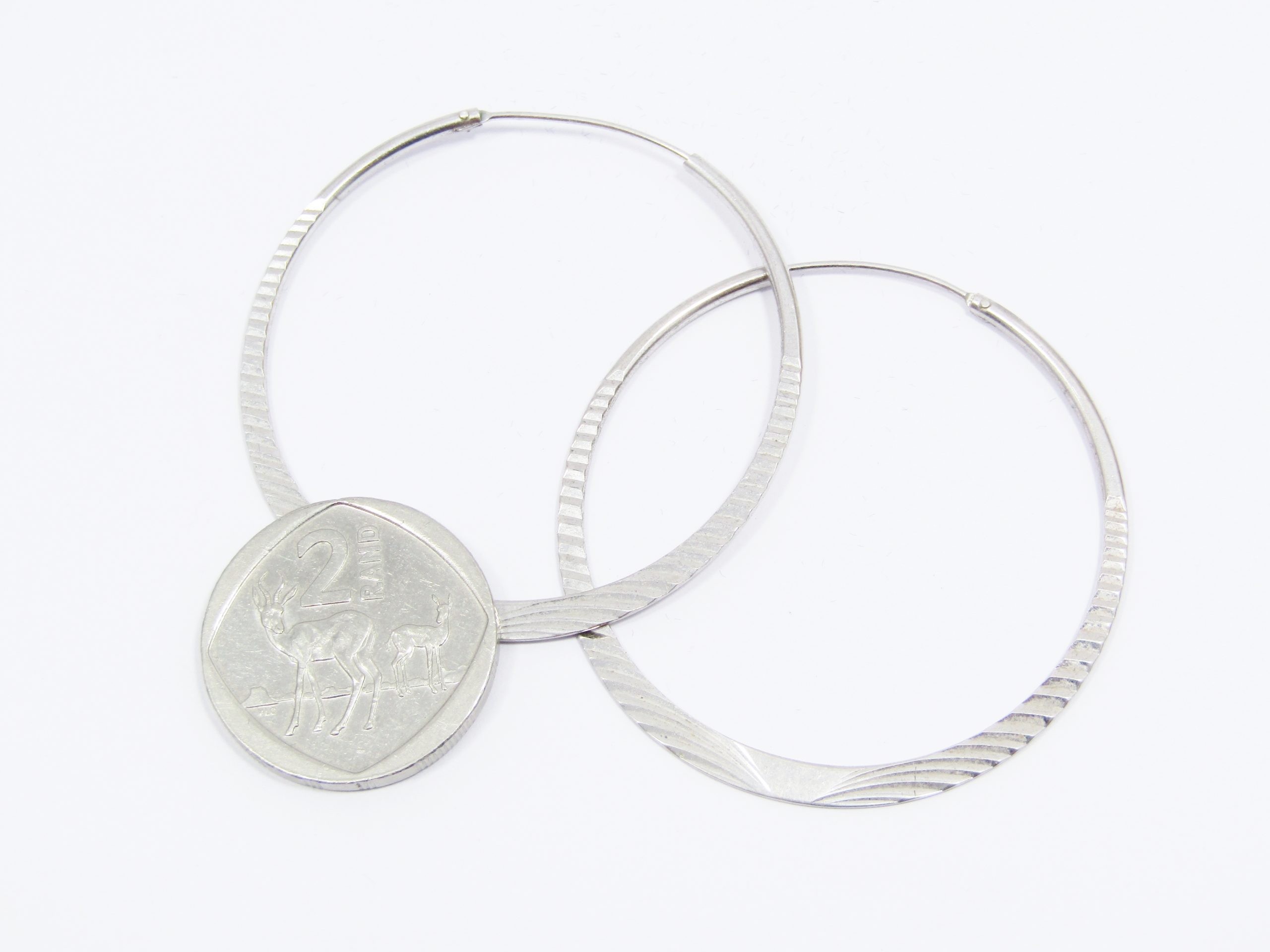 A Stunning pair of Textured Gypsy Hoop Earrings in Sterling Silver