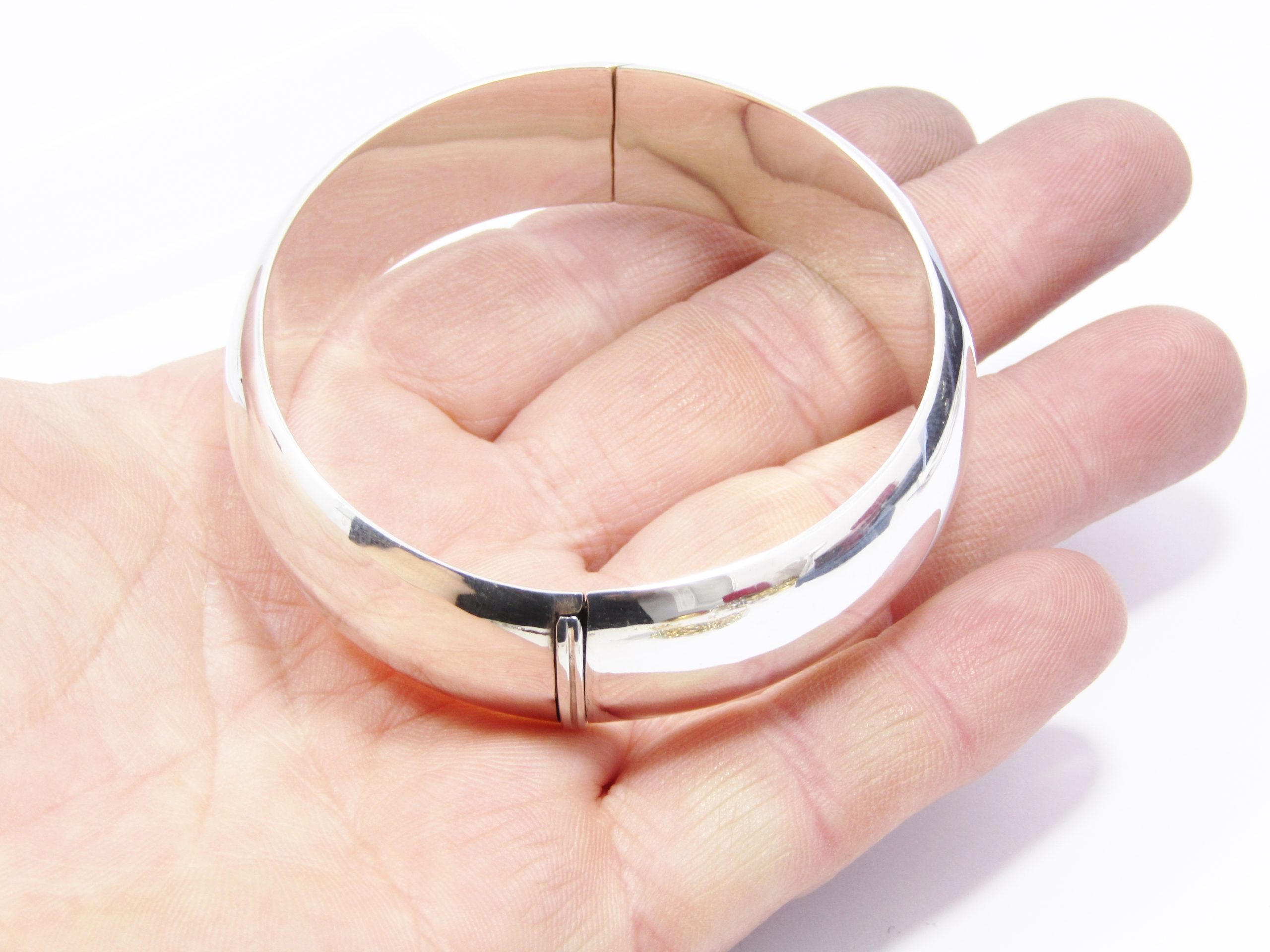 A Beautiful Broad Hinged Bangle in Sterling Silver